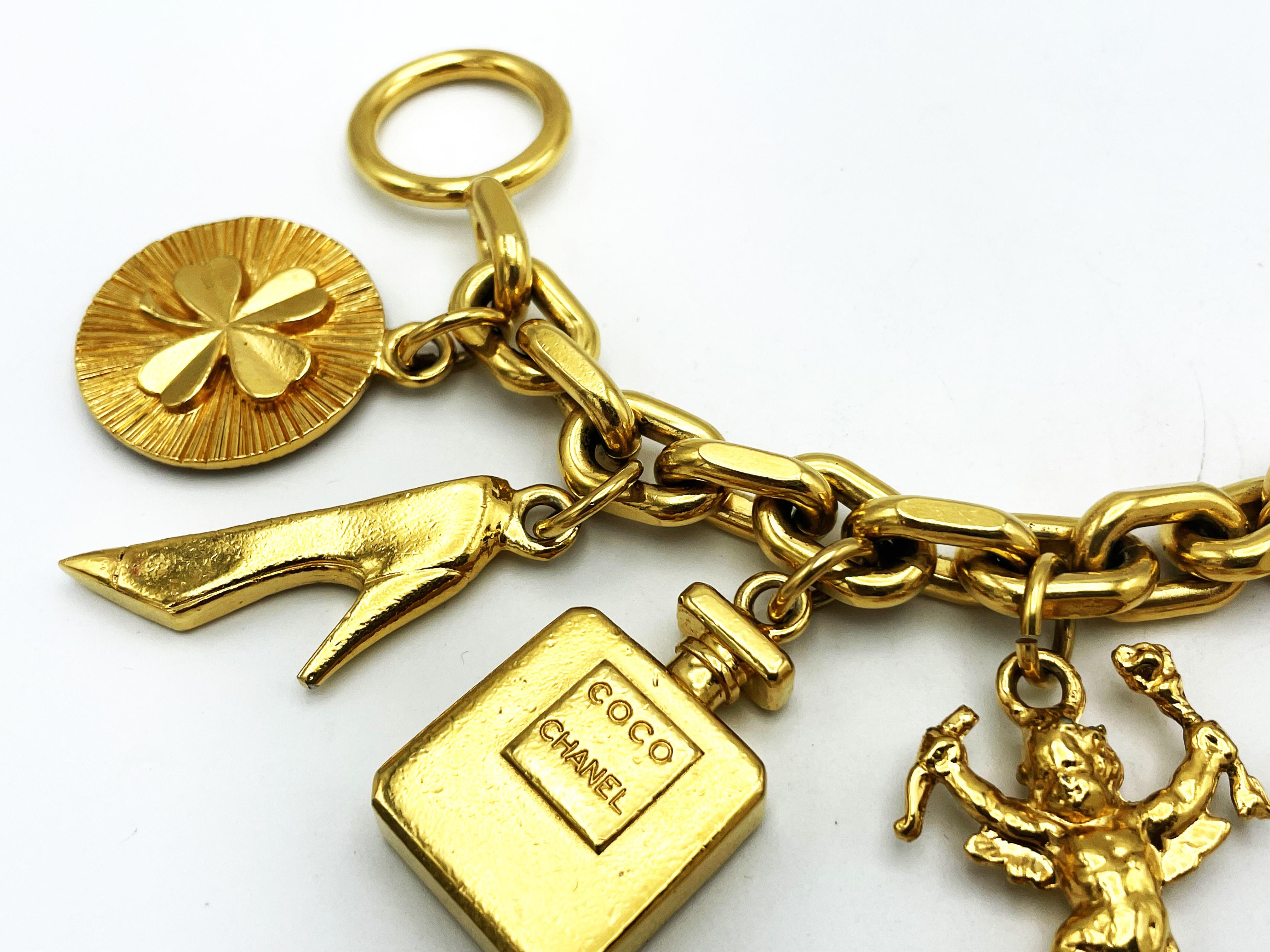 Modern CHANEL lucky charm bracelet with 7 iconic Chanel pendants gold-plated, 1990 For Sale