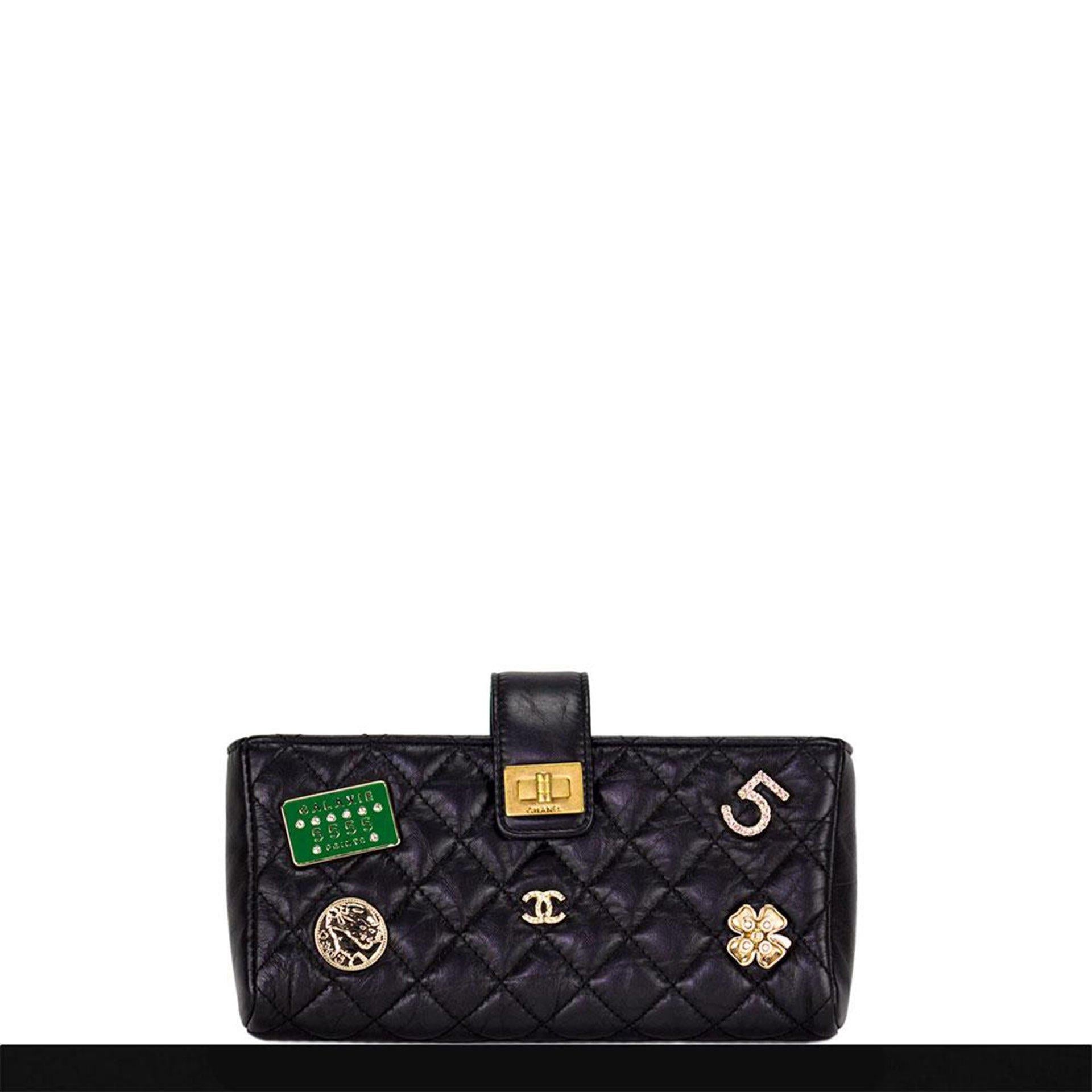 Lambskin Chanel quilted soft leather with magnetic closure and interior double compartments.

2016 
Black leather
Antique gold hardware
Interior zipper pocket
5 charms
Interwoven chain
Suede lining
7” W x 3.5” H x 1.5” D
Strap Drop 24”

Made in Italy