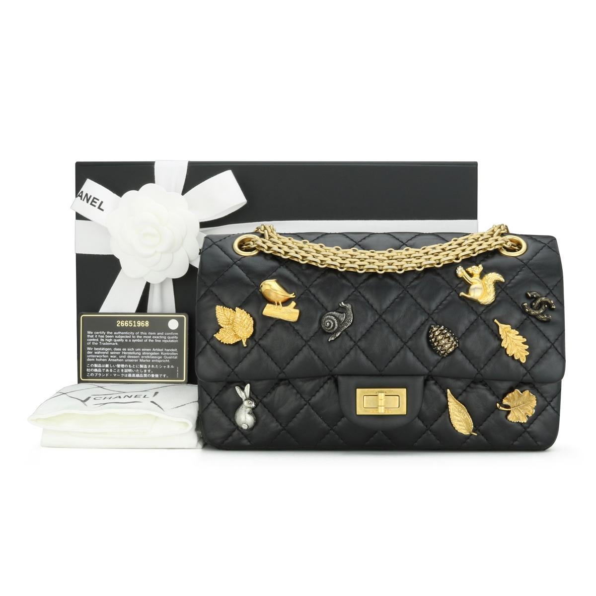 CHANEL Lucky Charms 2.55 Reissue 225 Quilted Flap Bag in Black Aged Calfskin with Aged Gold-Tone Hardware 2018- 18K.

This stunning bag is in immaculate condition; it still holds its original shape, and the hardware is still very shiny.

This