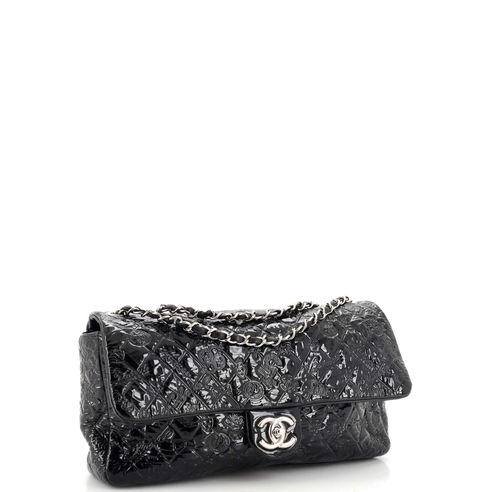 Condition: Very good. Light odor in interior. Creasing, minor wear and loss of luster on exterior, moderate wear on strap, creasing and scuffs underneath flap. Marks, glitter and wear in interior, scratches on hardware.
Accessories: No