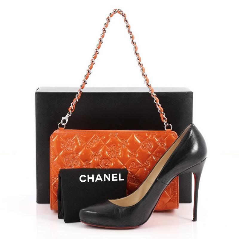 This authentic Chanel Lucky Symbols Pochette Embossed Quilted Patent is a chic and functional pochette perfect for nights out. Crafted in orange diamond quilted patent leather, this pochette features embossed unique lucky symbols such as Chanel No.