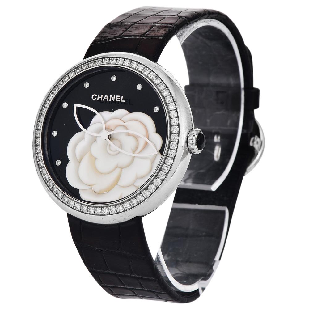  Chanel Mademoiselle Prive 18K white gold Diamond and mother of Pearl carved flower on black dial watch. 
Circa 2017 in white gold with natural diamonds Ladies wrist watch. 37mm dial diameter and 40mm with crown. The diamonds are factory set on the