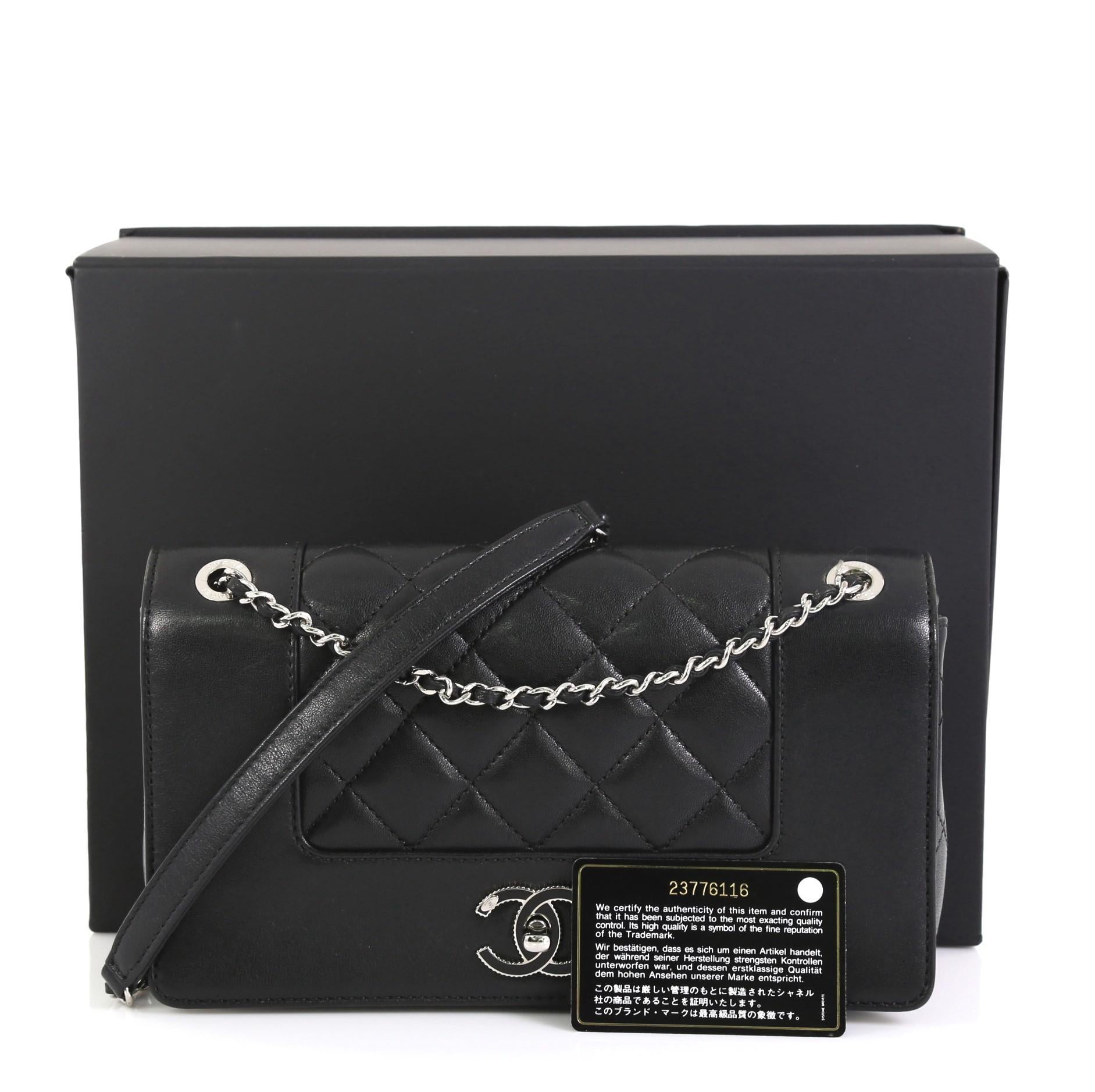 This Chanel Mademoiselle Vintage Flap Bag Quilted Sheepskin Small, crafted in black quilted sheepskin, features woven-in leather chain strap and silver-tone hardware. Its CC turn-lock closure opens to a black fabric interior with zip pocket.