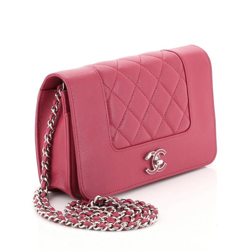 This Chanel Mademoiselle Vintage Wallet on Chain Quilted Sheepskin, crafted in pink quilted sheepskin, features woven-in leather chain strap, full-frontal flap with gold leather embedded Chanel CC turn lock and silver-tone hardware. Its turn-lock
