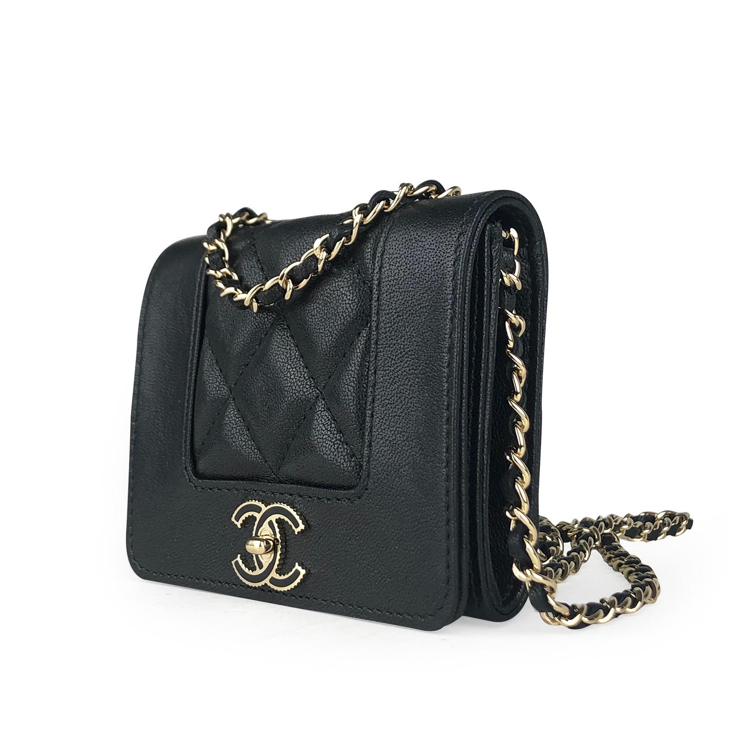Black quilted lambskin Chanel Mademoiselle Wallet on Chain with

- Gold-tone hardware
- Single chain-link and leather shoulder strap
- CC logo adornment at front
- Black interior, 3 interior pockets pockets and snap closure at front flap

Overall