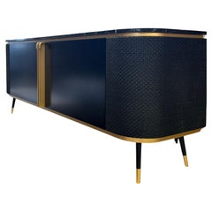 Chanel custom black lacquered marble top sideboard , doors covered in woven leather