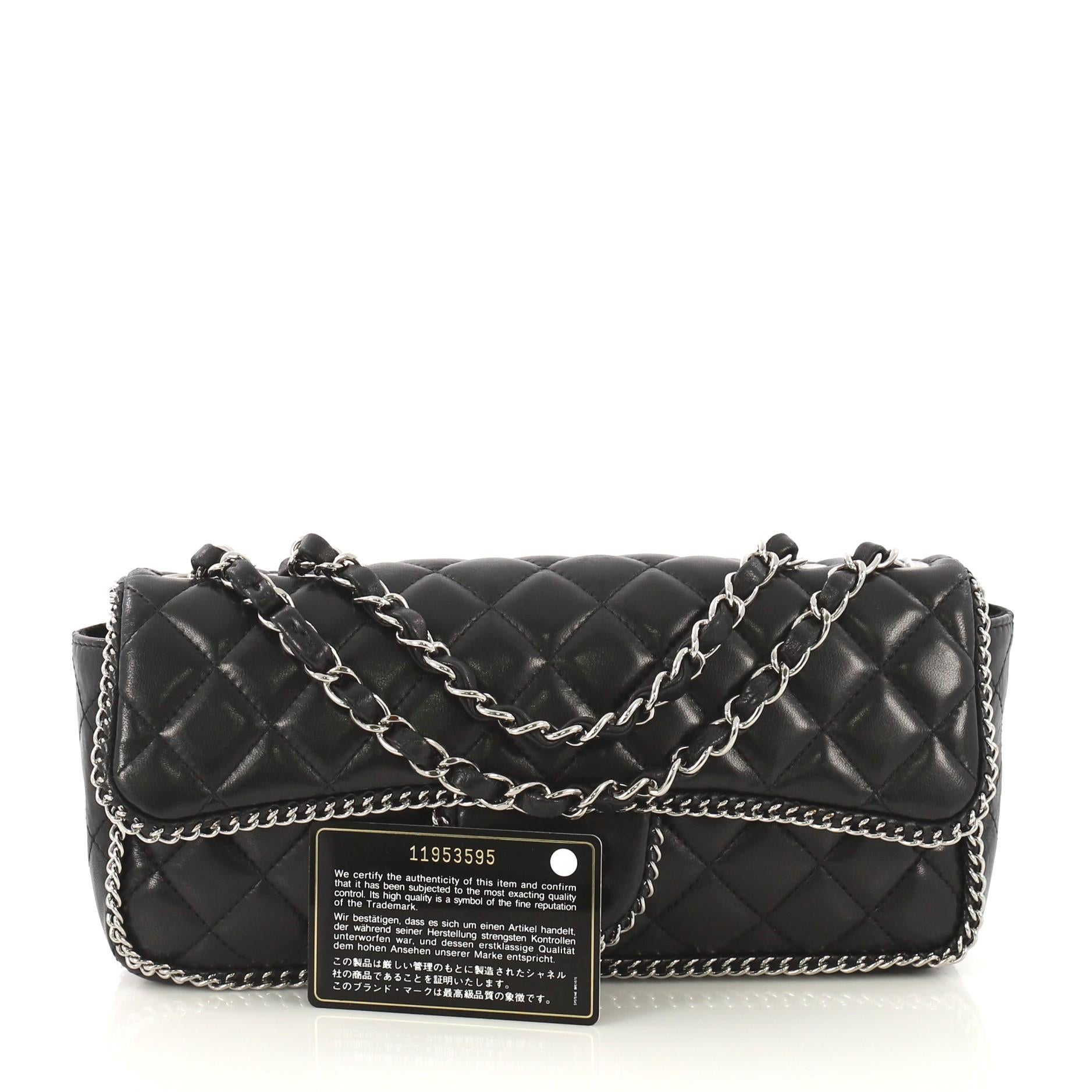 This Chanel Madison Chain Around Flap Bag Quilted Lambskin East West, crafted in black quilted lambskin leather, features woven-in leather chain strap, chain-link trim and silver-tone hardware. Its turn-lock closure opens to a black fabric interior