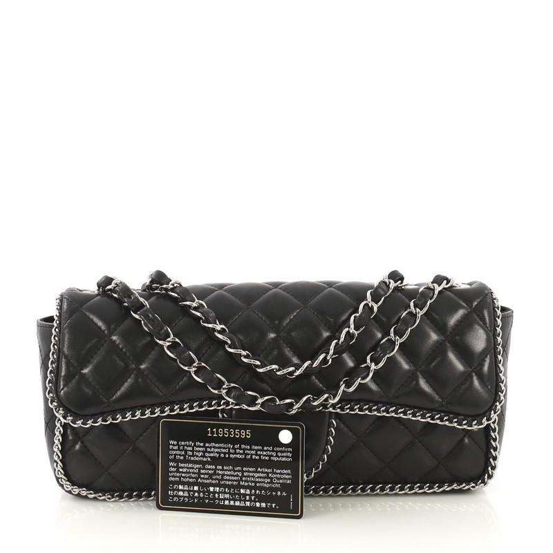 This Chanel Madison Chain Around Flap Bag Quilted Lambskin East West, crafted in black quilted lambskin leather, features woven-in leather chain strap, chain-link trim and silver-tone hardware. Its turn-lock closure opens to a black fabric interior
