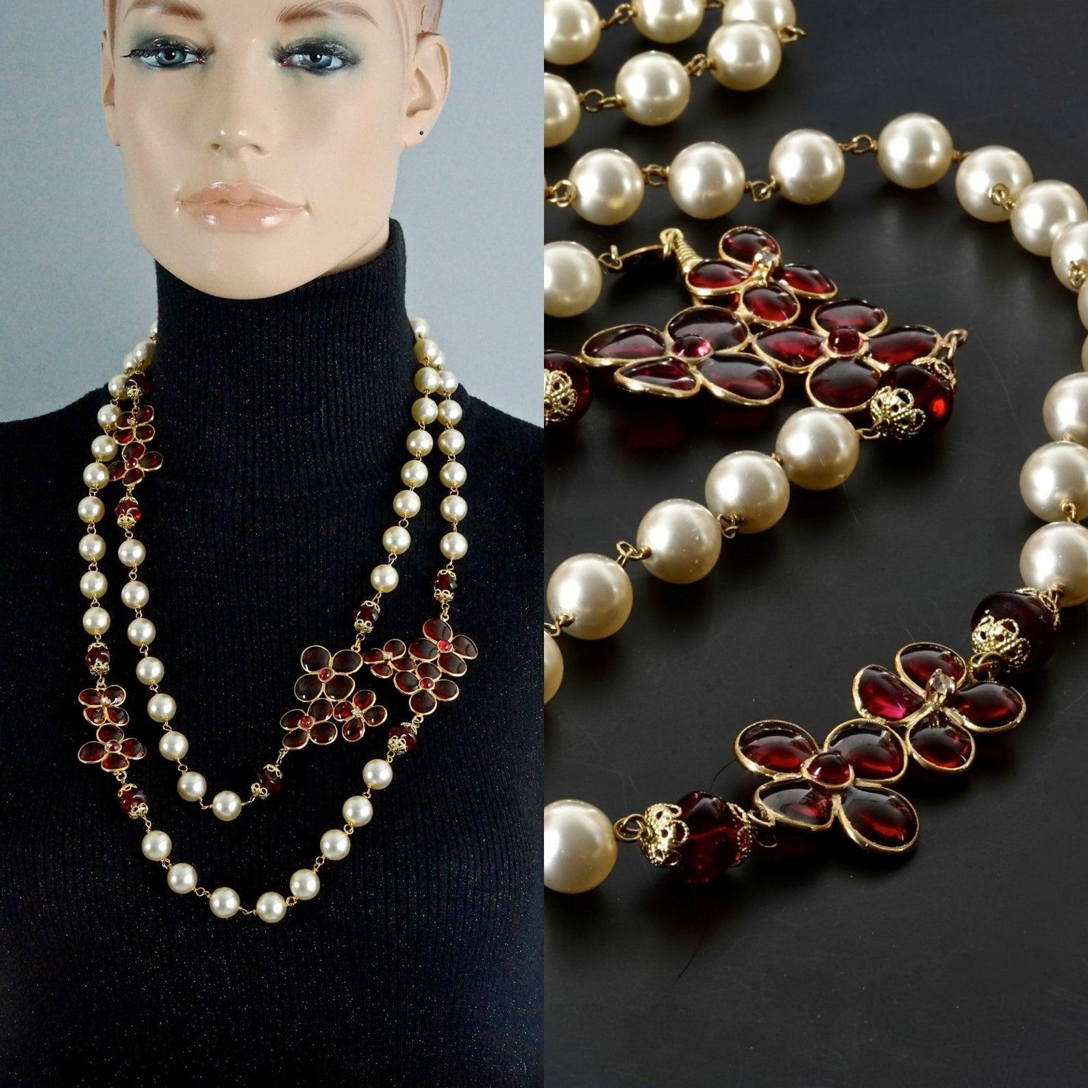 Features:
- 100% Authentic CHANEL by MAISON GRIPOIX.
- Long pearl necklace with red gripoix/ poured glass flowers.
- Gold tone hardware.
- Signed Chanel CC Made in France.
- Could be used as a long single strand necklace or double strand necklace.
-
