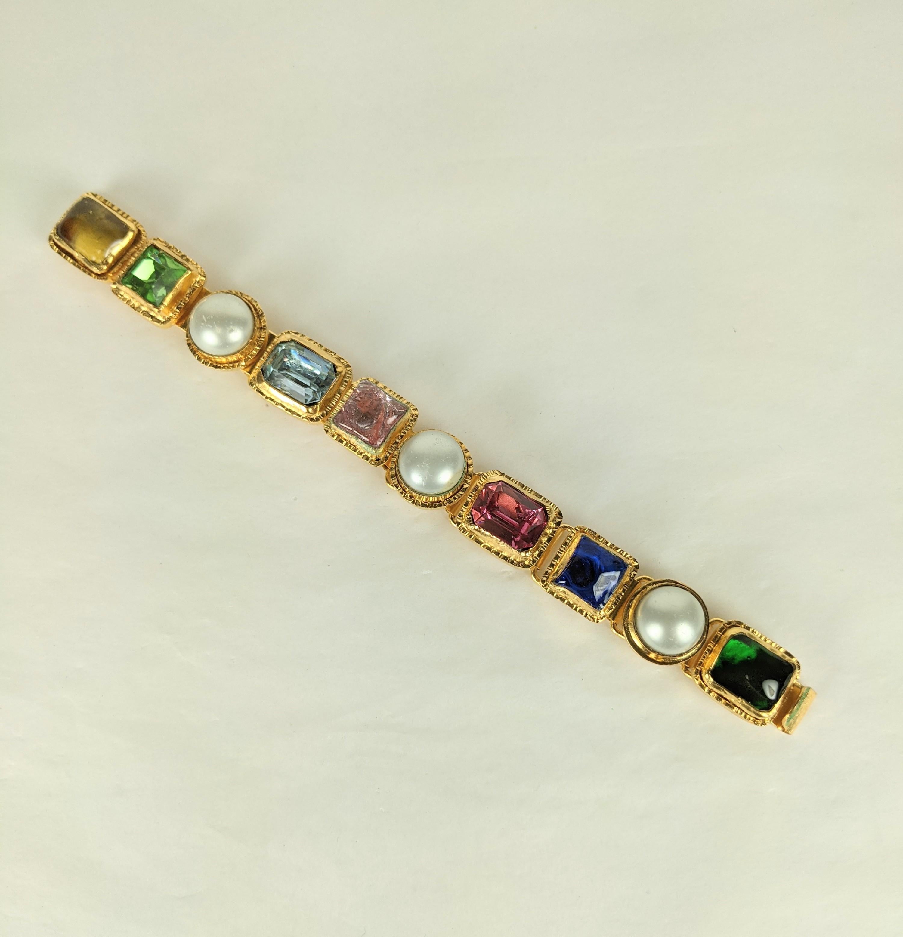 Chanel early Maison Gripoix Renaissance style link bracelet. Composed of flexible multilinks of faux baroque pearl cabocheons, faceted rectangular crystal, and Gripoix  poured glass enamel  square cabocheons. Handmade gilt bronze settings. Marked