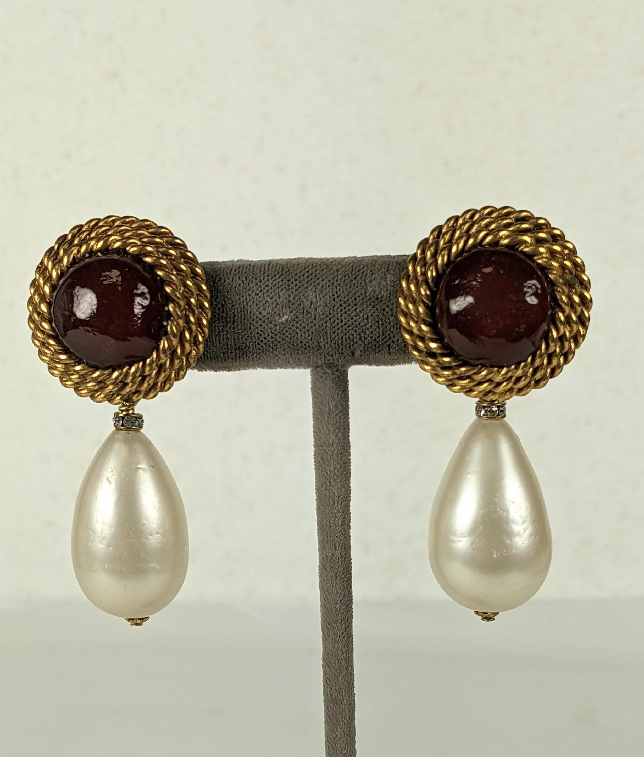 Classic Elegant Chanel Maison Gripoix Ruby Pate de Verre and Faux Pearl Earrings from the 1980's. Handmade by Maison Gripoix in gilt bronze twisted wire with ruby poured glass and large handmade pearl drop with pave rondel cap. Made during the Karl
