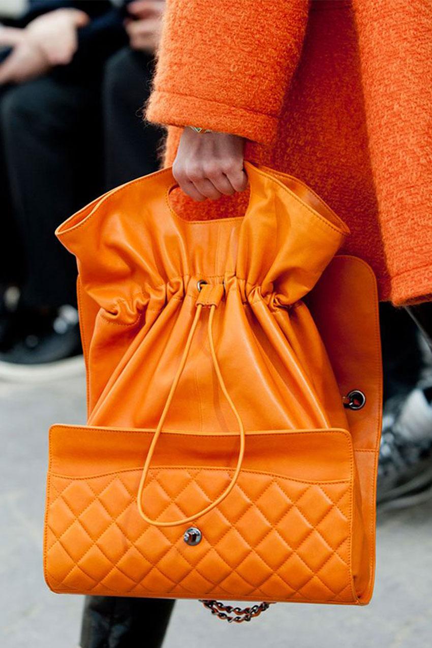 Chanel Mandarin Orange Caviar Expandable 2 in 1 Shopper Drawstring Flap Bag 

Look 19 from the Fall 2014 Collection. 

Orange quilted lambskin Chanel Flap Bag with gunmetal hardware, dual chain-link and leather shoulder straps, single exterior slit