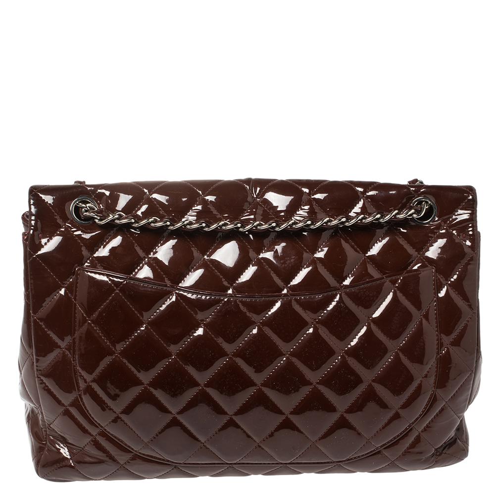 We're bringing Chanel's iconic Classic Flap bag to your closet with this creation. Beautifully crafted from patent leather and covered in the diamond quilt, it bears the signature label on the lined interior and the iconic CC turn-lock on the flap.