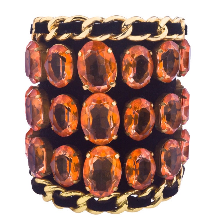 Very important, extremely rare massive Chanel bangle with chain detail and orange rhinestones on black velvet.
This amazing bangle was featured in Chanel ad in 1991. 