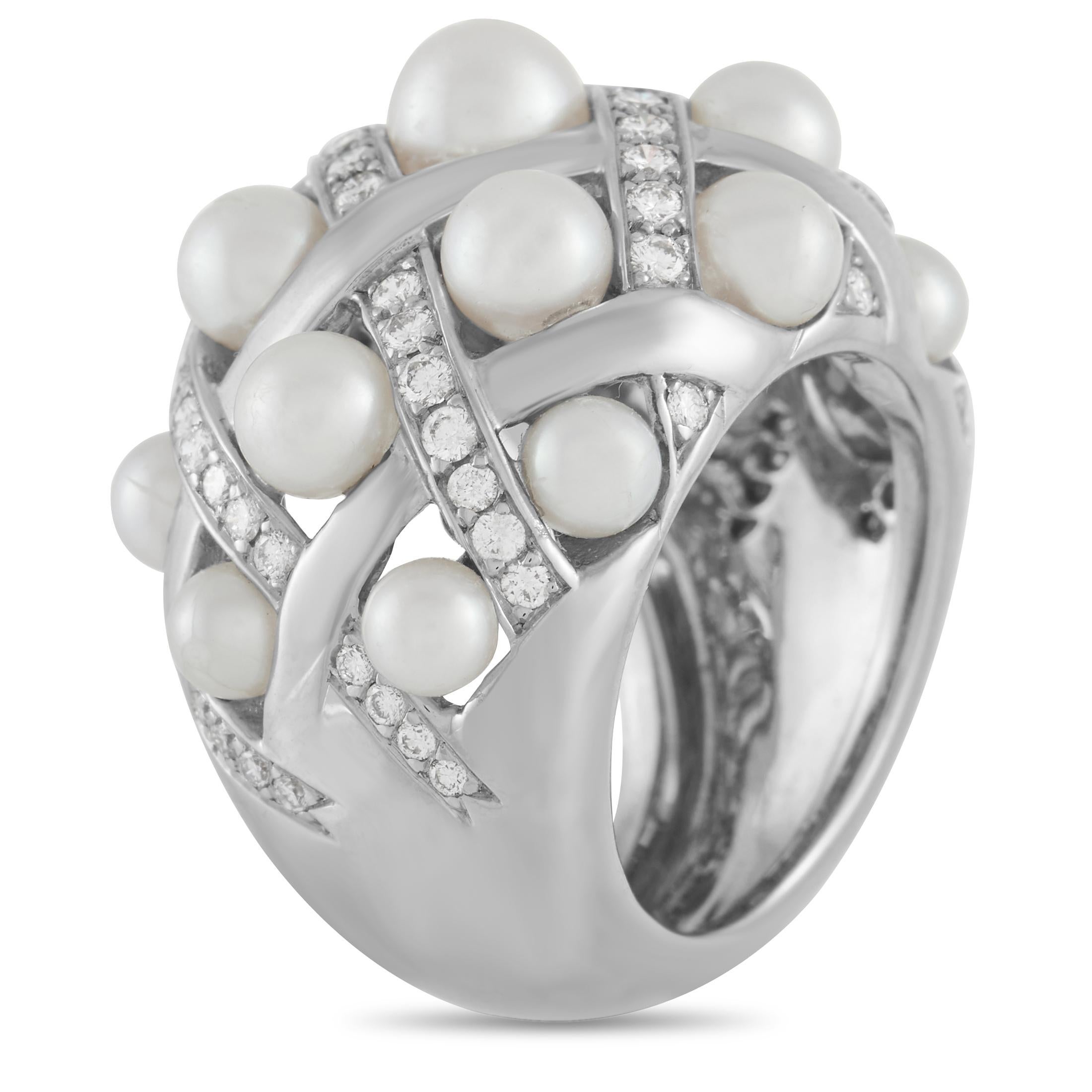 Shimmering 18K white gold metal in a chic lattice pattern provides the perfect foundation for this bold, breathtaking ring from Chanel. It’s accented by an array of lustrous pearls and 0.75 carats of glittering diamonds with E color and VVS clarity.