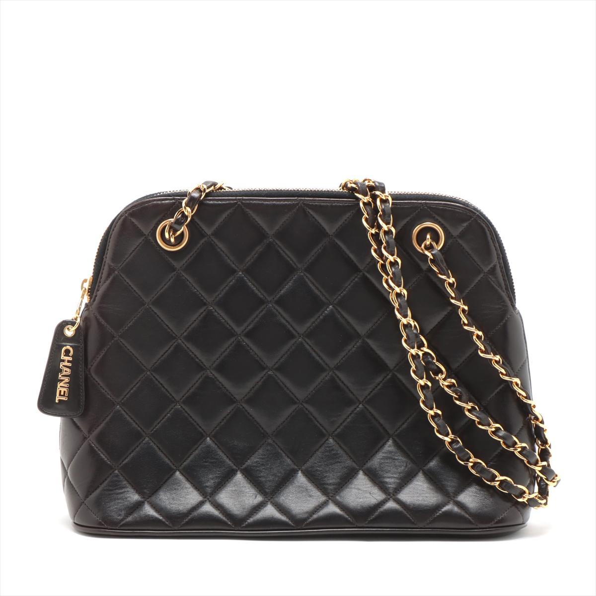 The Chanel Matelassé Lambskin Chain Shoulder Bag in Black epitomizes timeless elegance and luxury. Crafted from supple lambskin leather, the bag features Chanel's iconic quilted pattern, showcasing meticulous craftsmanship and attention to detail.