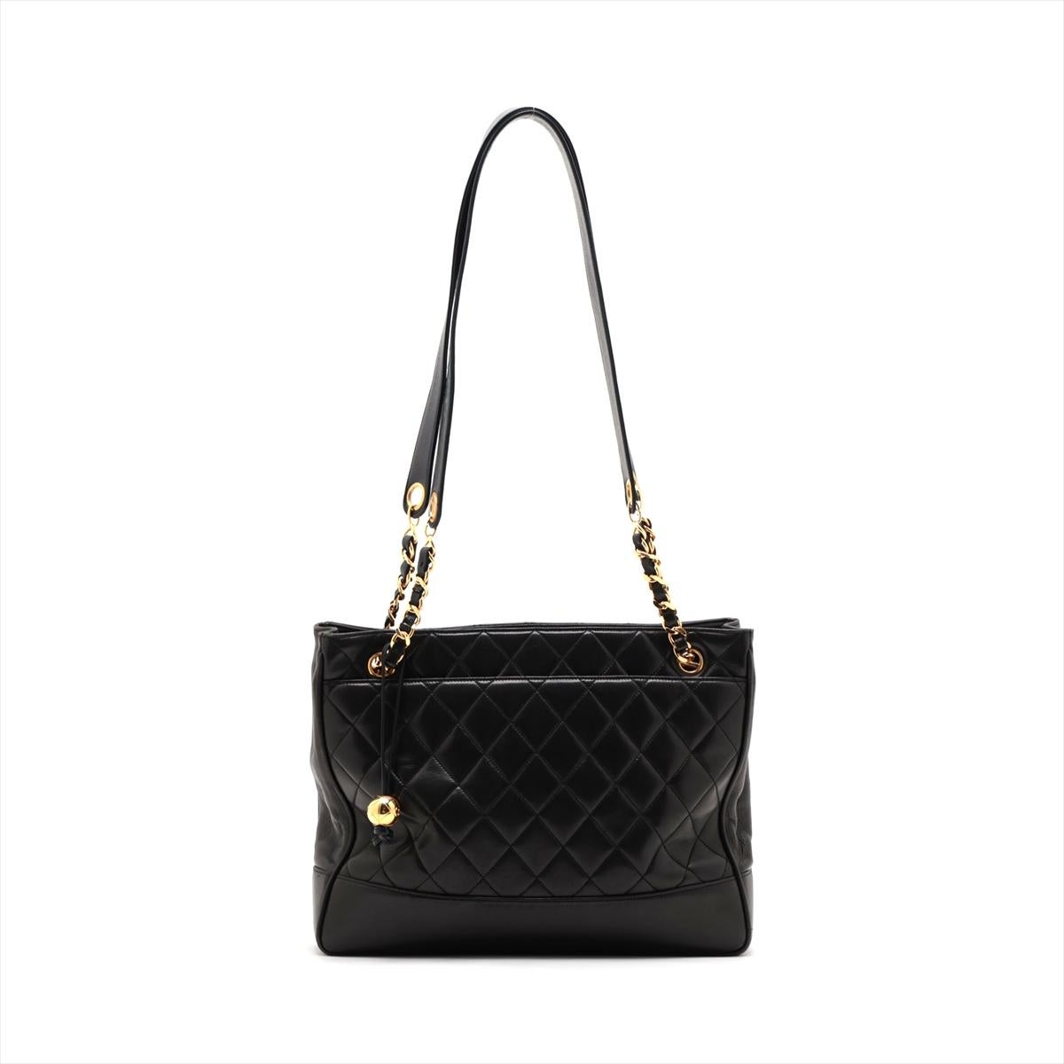 The Chanel Matelasse Lambskin Chain Tote Bag in Black embodies the essence of timeless elegance and sophistication. Crafted from luxurious lambskin leather, the tote features Chanel's iconic quilted pattern, adding a touch of texture and dimension