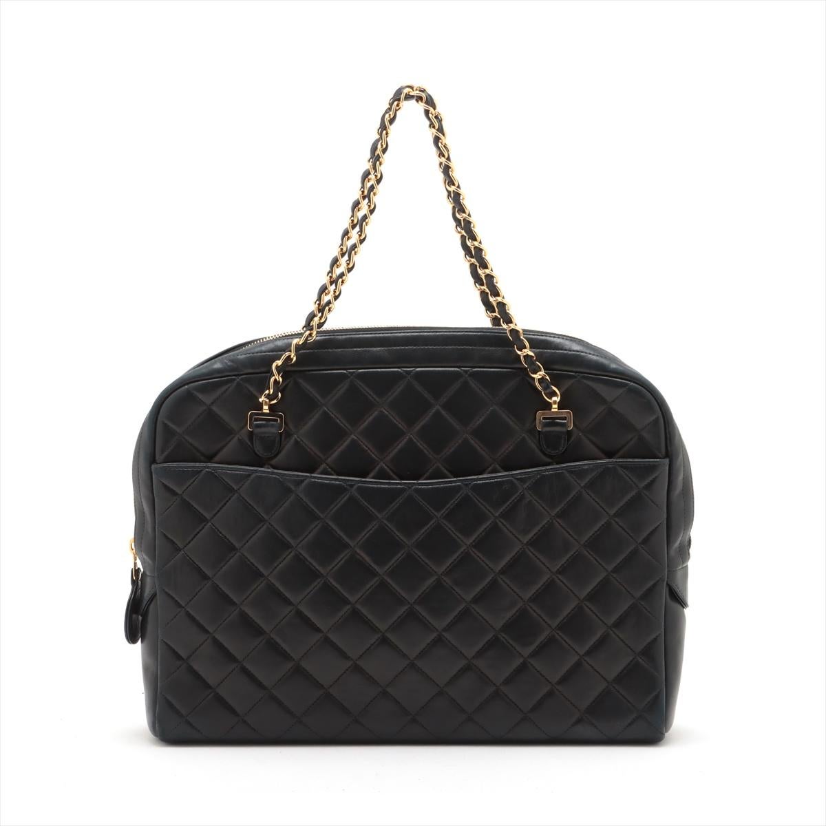 The Chanel Matelassé Lambskin Chain Tote Bag in black is a luxurious and versatile accessory that combines timeless elegance with functional design. Crafted from supple lambskin leather, the tote features classic matelassé quilted pattern and a