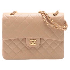 *Chanel Matelasse in pelle di agnello con doppia patta e doppia catena Beige