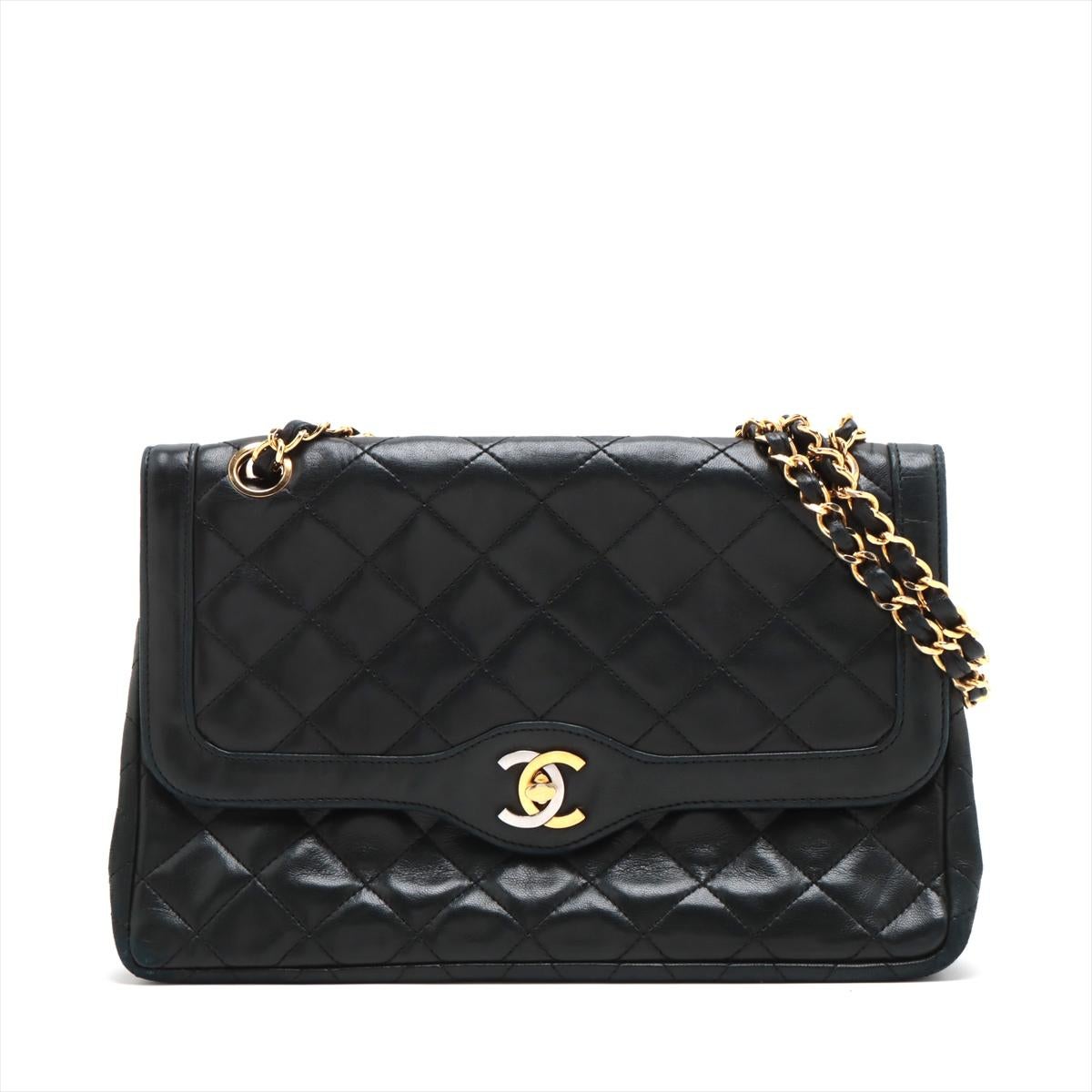 The Chanel Matelasse Lambskin Paris Double Flap Double Chain Bag in Black is an iconic and timeless accessory that epitomizes Chanel's legacy of luxury and elegance. Meticulously crafted, the classic double flap bag is made from sumptuous lambskin