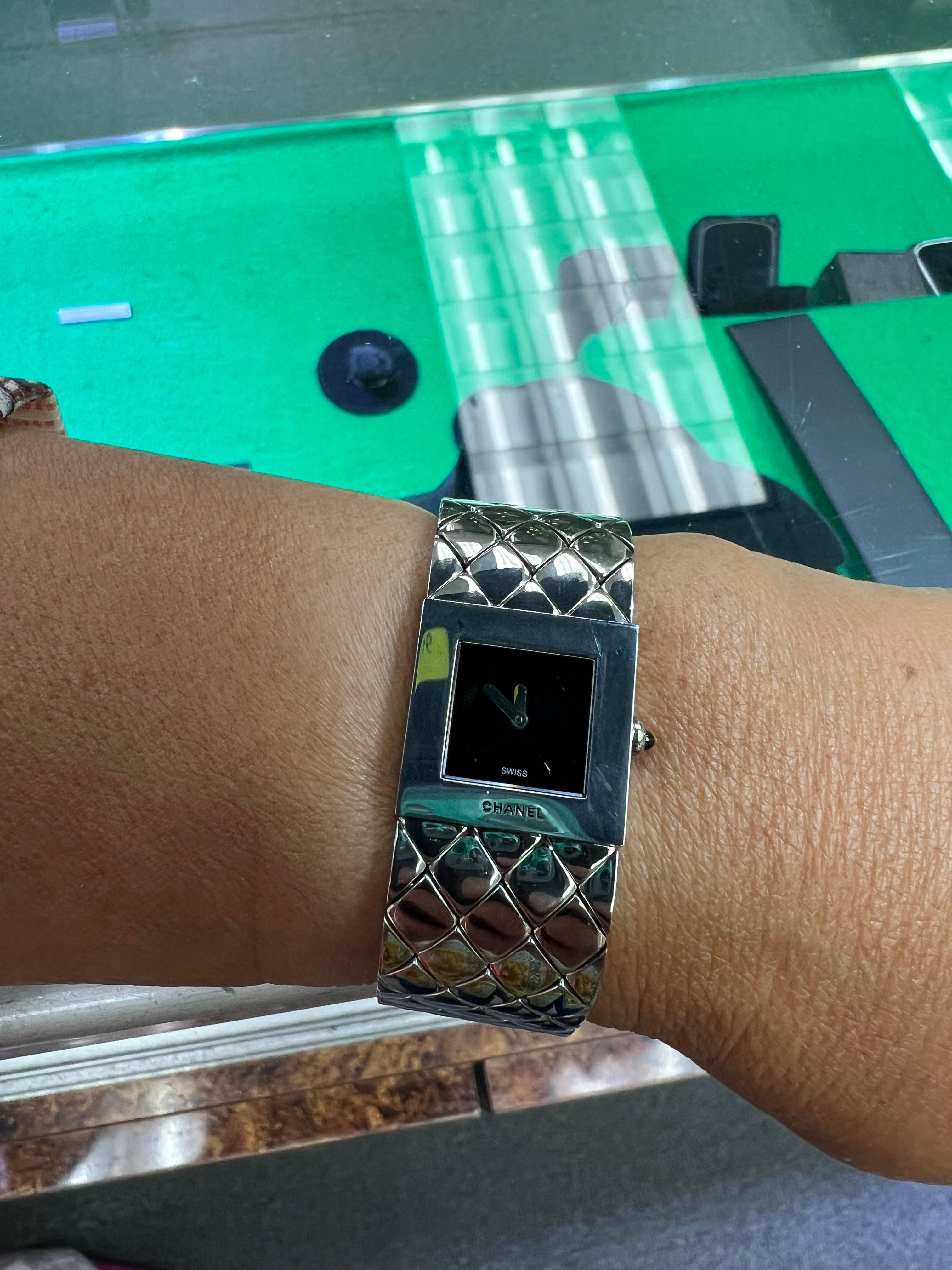 Chanel Matelasse quilted stainless steel wristwatch, circa 1990s, fits a small wrist.

The Chanel Matelassé Quilted Stainless Steel Wristwatch, produced in the 1990s, exemplifies the intersection of luxury and functionality that characterizes