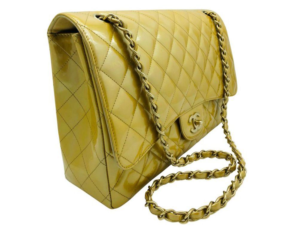 Exquisite Chanel Classic Maxi single flap bag in gold patent leather with gold hardware.  This bag is preloved and shows signs of wear on the corners and interior but is in very good condition – do look at photos.
BRAND	
Chanel

FEATURES	
CC Clasp