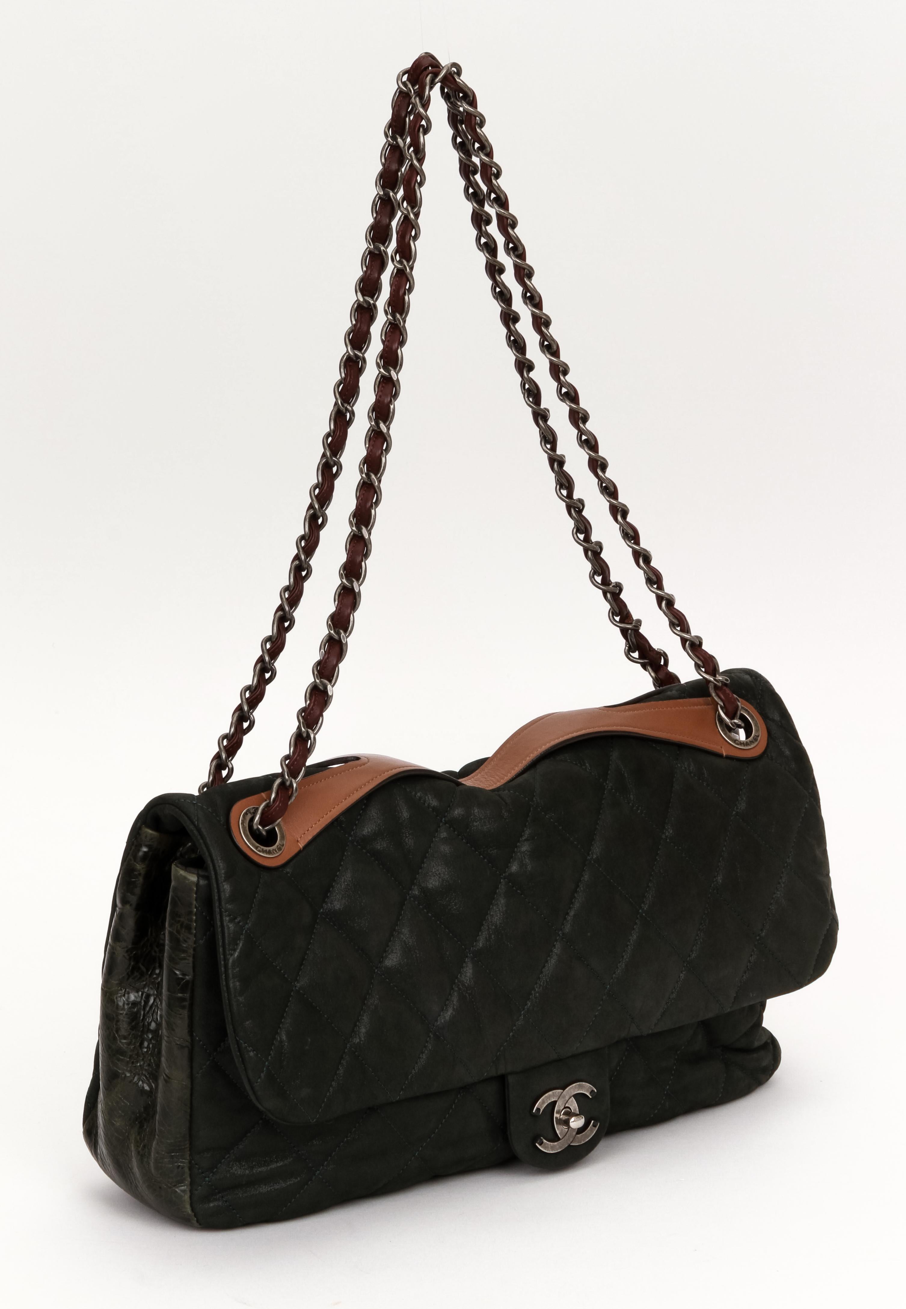 Chanel maxi single flap in combined glazed and cracked leather. Brown contrast handle, ruthenium hardware chain with burgundy woven leather. Shoulder drop 12