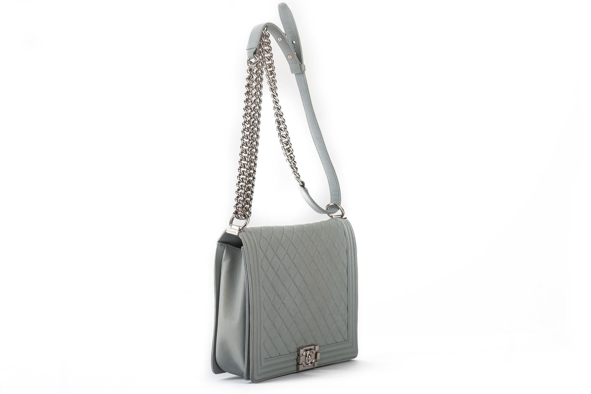 Chanel maxi grey caviar leather boy bag with silver tone hardware. Adjustable strap 20”. Collection 17. Comes with hologram and original dust cover.