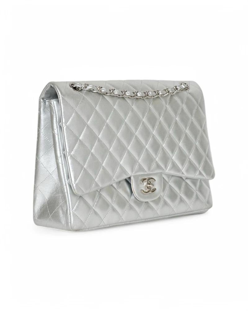 Chanel signature bag, Timeless line, Maxi Jumbo model, made of smooth leather in sophisticated silver color with silver hardware. The bag features a flap with a swivel closure and the classic 