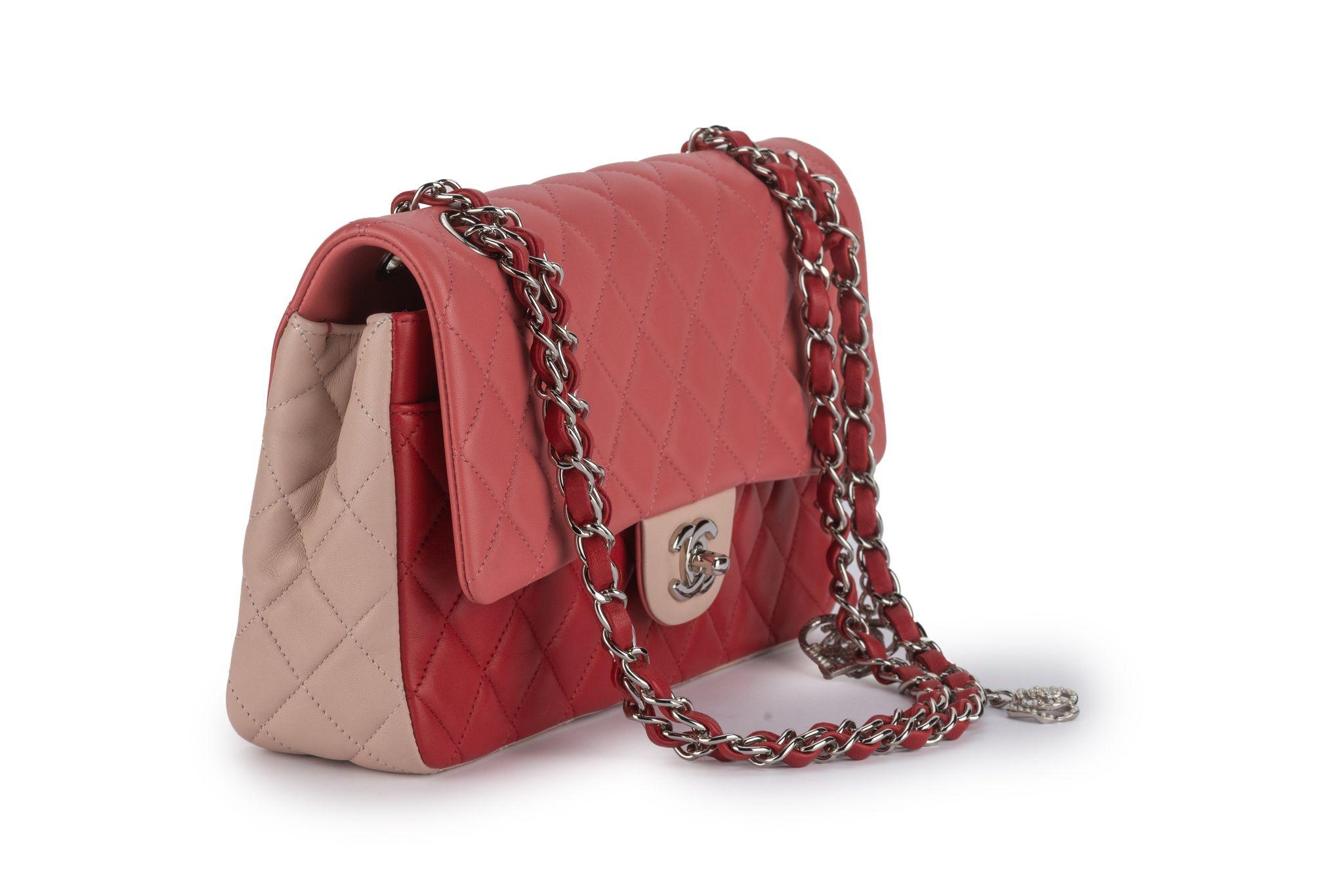 This Chanel medium classic single-flap bag is a tri-color bag in Pale Pink, Hot Pink and Red quilted lambskin leather with silvertone hardware and features, a front flap with signature CC turn-lock closure, and a half moon back pocket and an