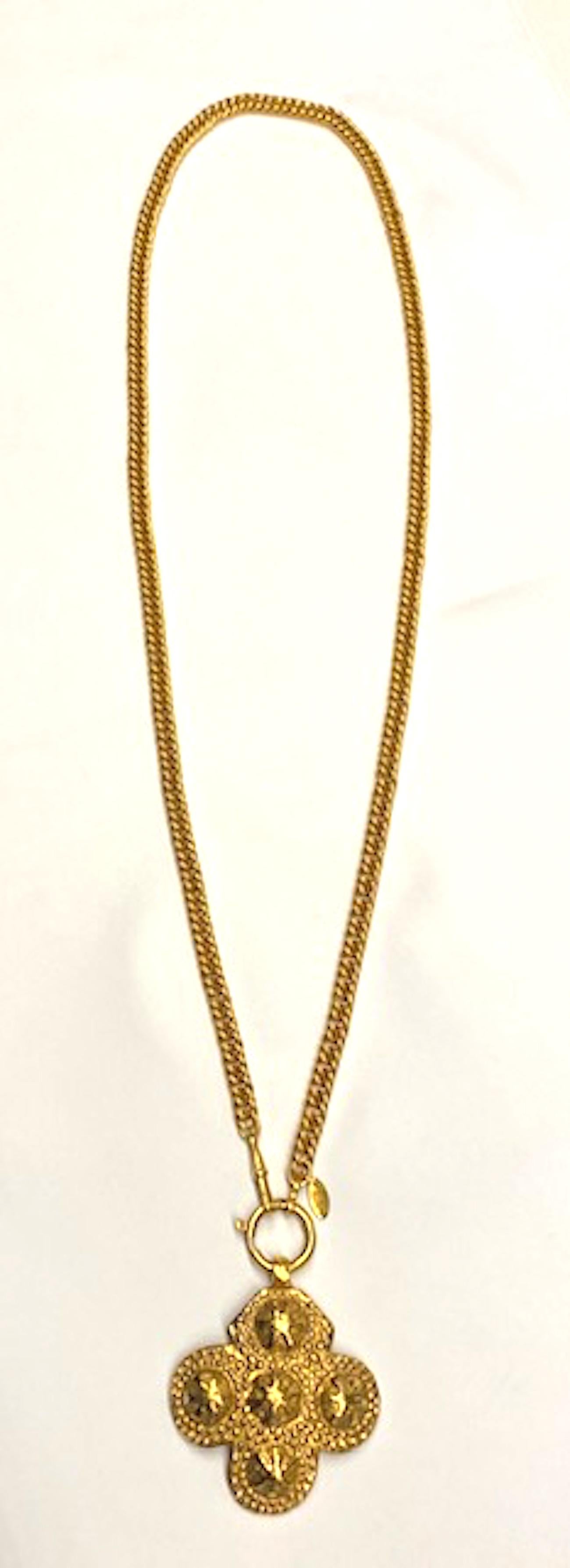 A very beautiful Chanel pendant necklace rich gold patina from 1986. The curb link chain is 34 inches long and .32 of an inch wide. It is a watch chain style with large jump ring on one end and an Albert watch clasp on the opposite end. The large