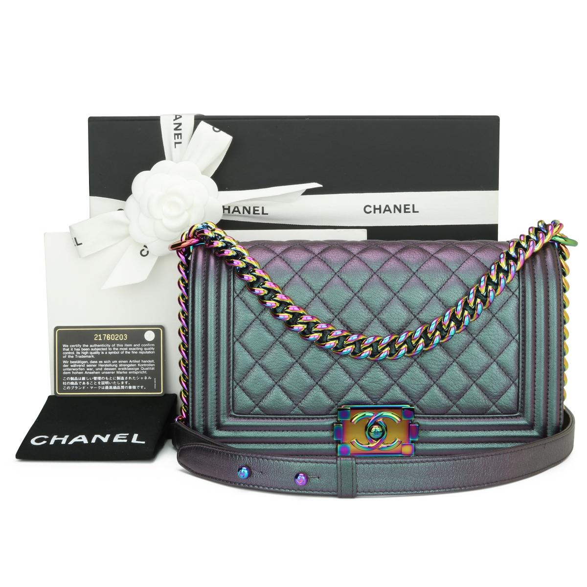 CHANEL Medium Boy Bag Quilted Iridescent Purple Goatskin with Rainbow Hardware 2016.

This stunning bag is still in excellent condition, the bag still holds its original shape, and the hardware is still very clean and shiny.

It is a truly stunning