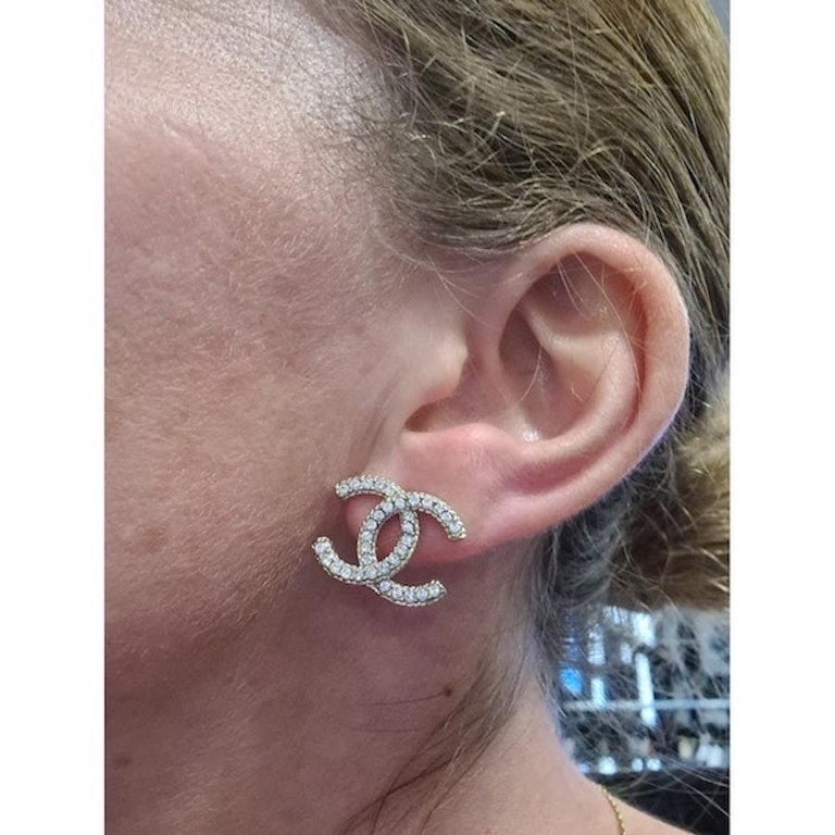 chanel cc earrings on ear