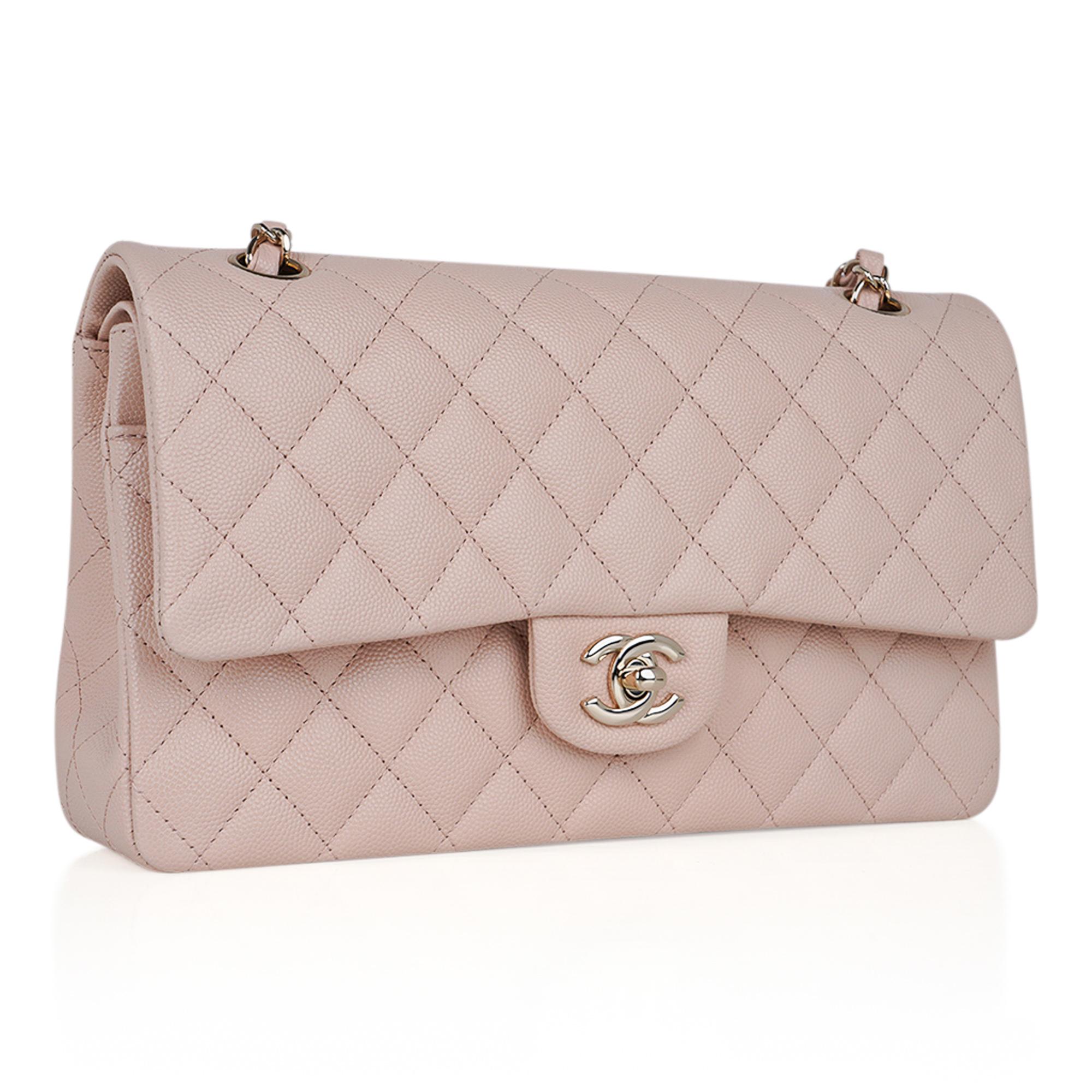 Mightychic offers a Chanel Classic Double Flap Bag featured in neutral Beige perfection.
Beautiful quilted Caviar leather with gold CC turn lock.
Dual chain link shoulder strap with woven leather detail.
Zip pocket under flap.
2 interior slot
