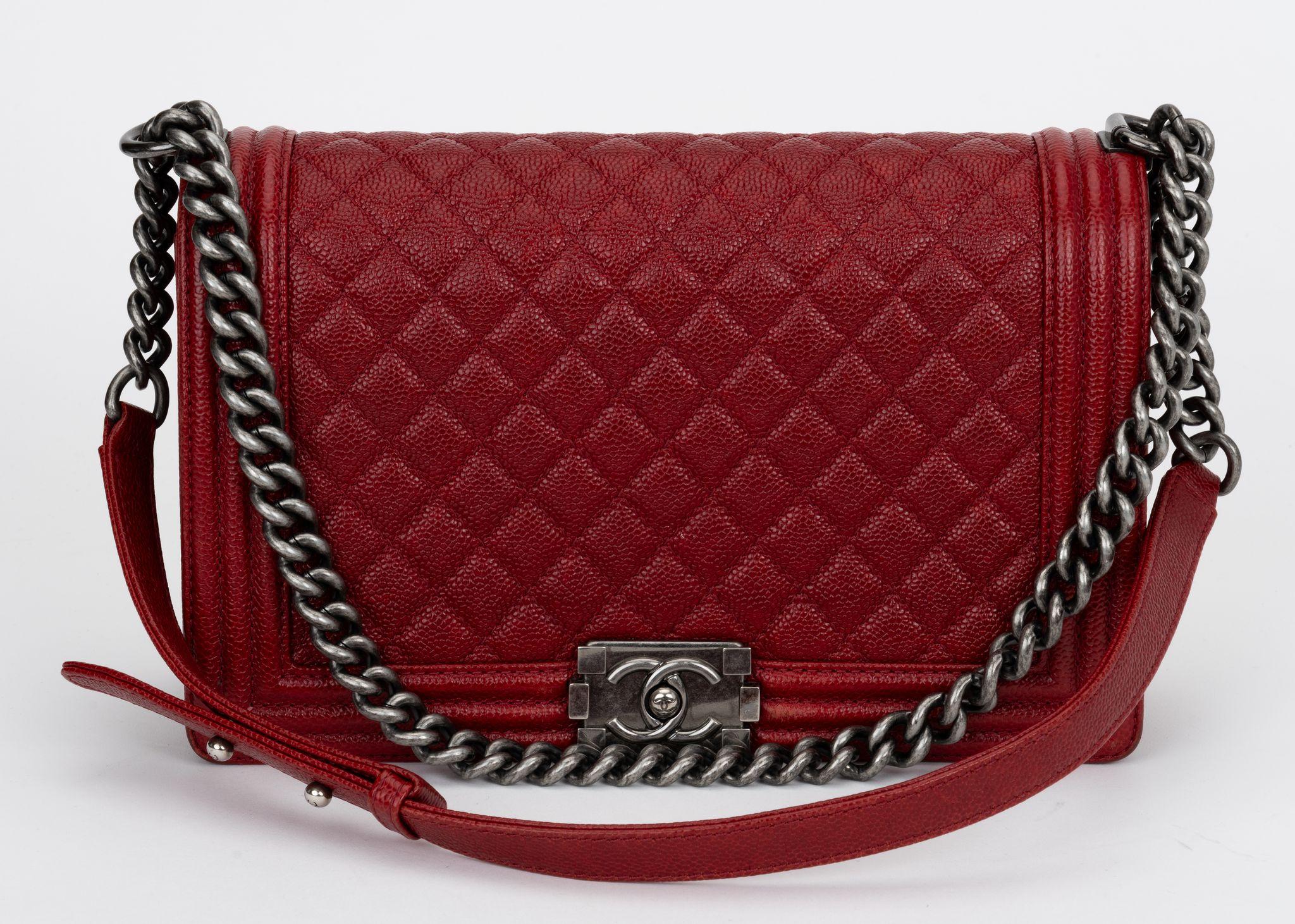 Chanel dark red caviar boy bag with ruthenium hardware. Minor wear on corners. Collection 19. Comes with hologram, id card and original dust cover.