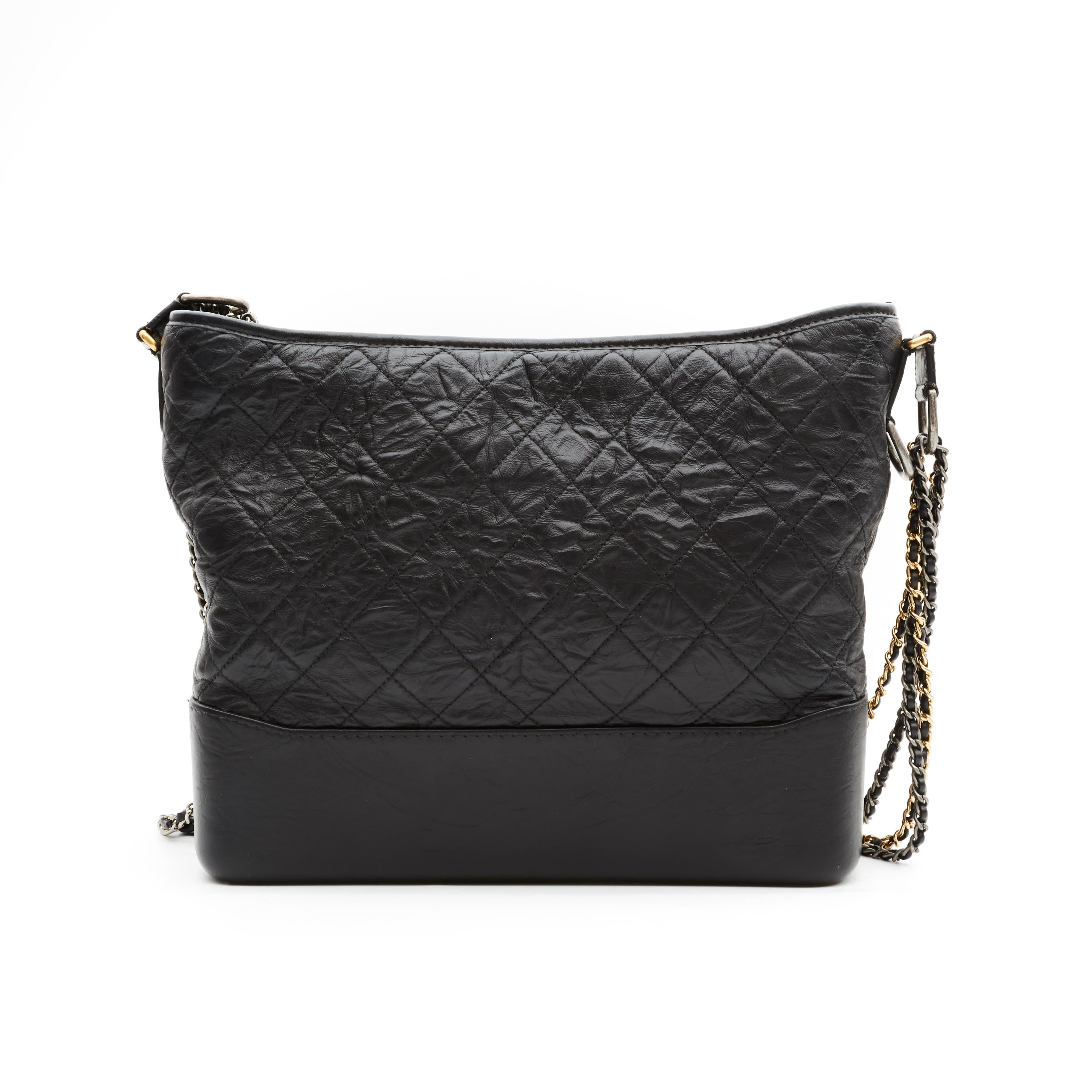 From the Spring 2017 collection, this current Gabrielle Hobo Bag is part of Chanel's new 'Gabrielle' line. This hobo bag features a sturdy base that provides structure for the quilted leather sides, a unique dual chain strap interlaced with leather,