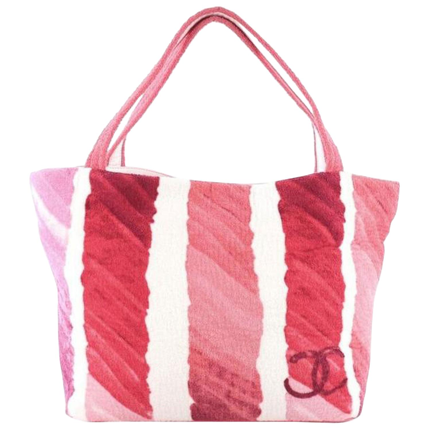This Chanel CC Beach Tote Terry Cloth Medium, crafted in pink Terry cloth, features dual terry cloth handles, printed CC logo, and silver-tone hardware. It opens to a pink terry cloth interior with slip pockets.

Condition: Excellent. Light wear and