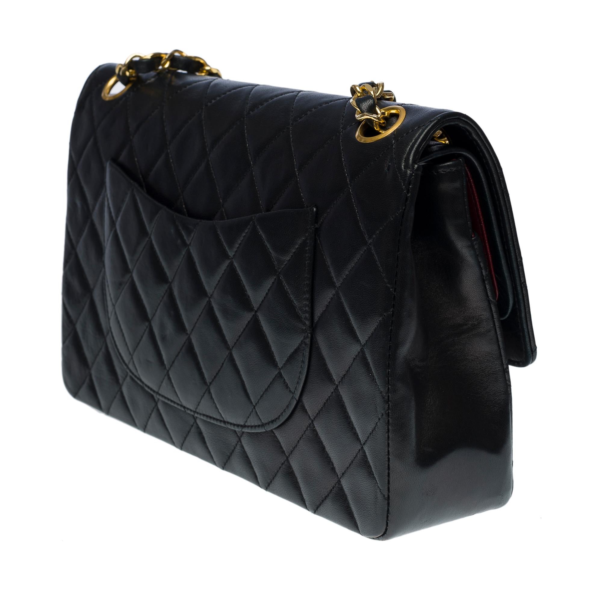 Chanel Medium Timeless double flap shoulder bag in black quilted lambskin, GHW In Excellent Condition In Paris, IDF