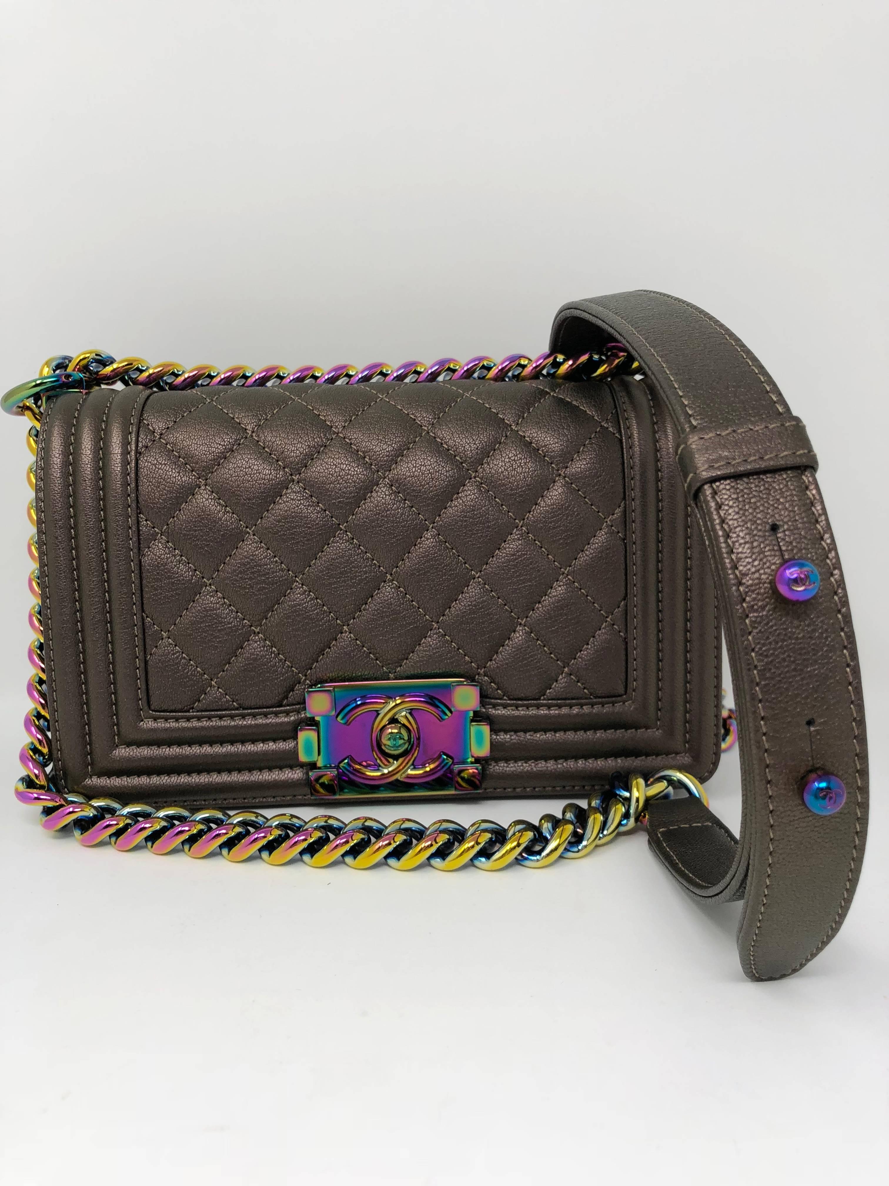 Authentic Chanel small Le Boy Flap Bag with rainbow hardware from the Cruise 2016 Collection. The bag is made of iridescent goat skin in bronze with rainbow hardware and strap. Limited edition and sold out with a waitlist worldwide. The color is