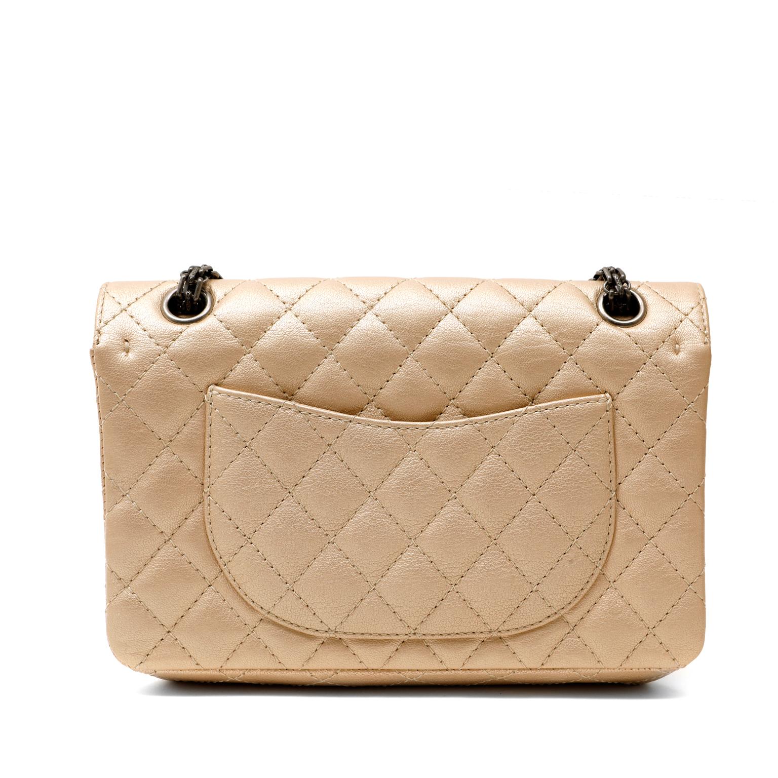 This authentic Chanel Metallic Beige Reissue Flap Bag is in pristine condition.  A soft neutral with a bit of edge, this Chanel is a great addition to any collection.
Beige quilted leather with a subtle metallic sheen can be worn with nearly any