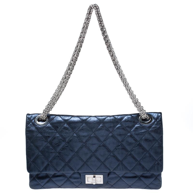 Chanel's Flap Bags are iconic and noteworthy in the history of fashion. This Reissue 2.55 is a buy that is worth every bit of your splurge. Exquisitely crafted from metallic blue leather, it bears their signature quilt pattern and the iconic