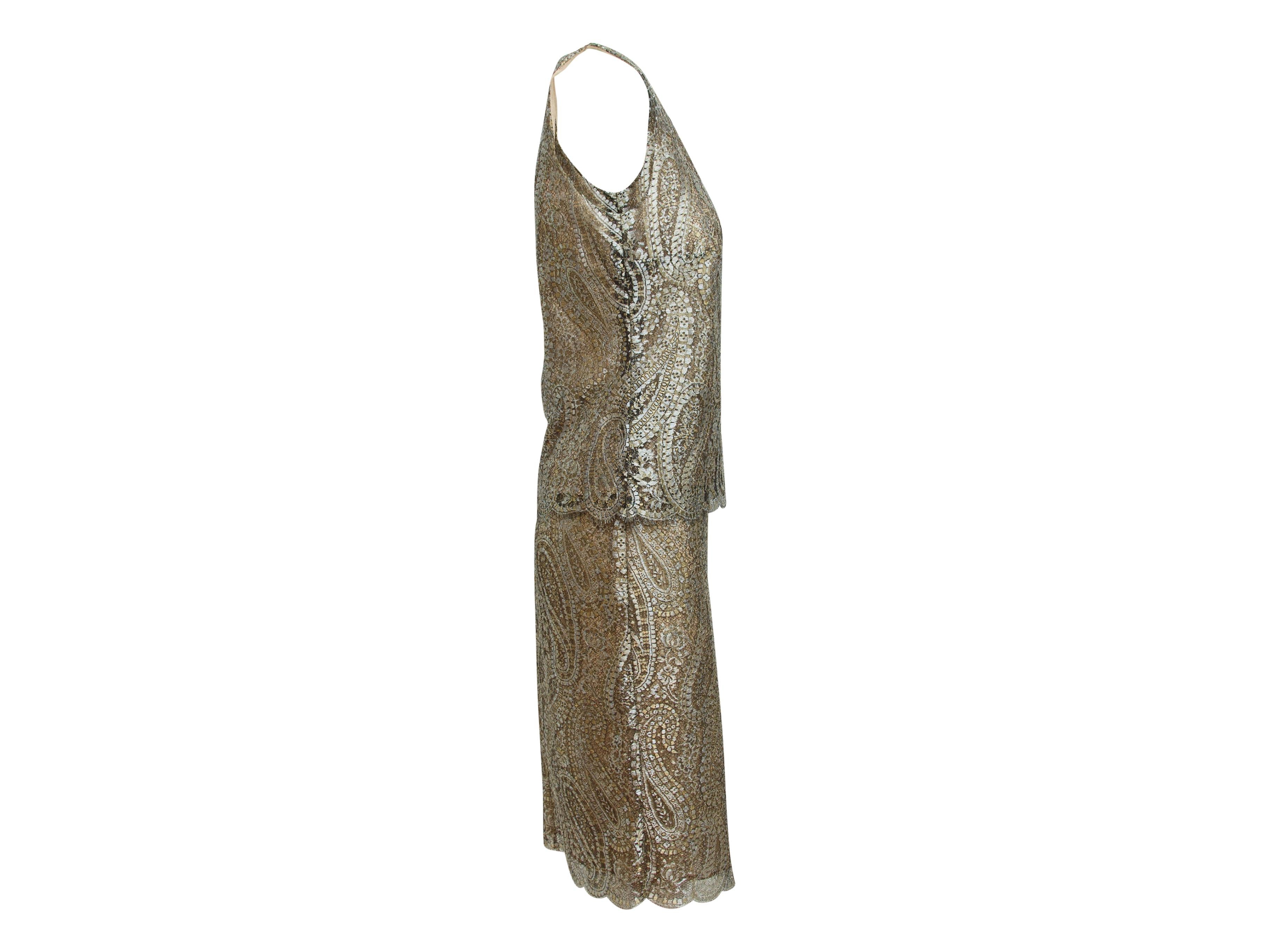 Product details: Metallic brocade Chanel sleeveless skirt set is an outfit that can be worn during holiday parties and summer weddings.  Both items are lined in nude. The shell has a scoop neck, scalloped hem, and closes in the back. The matching