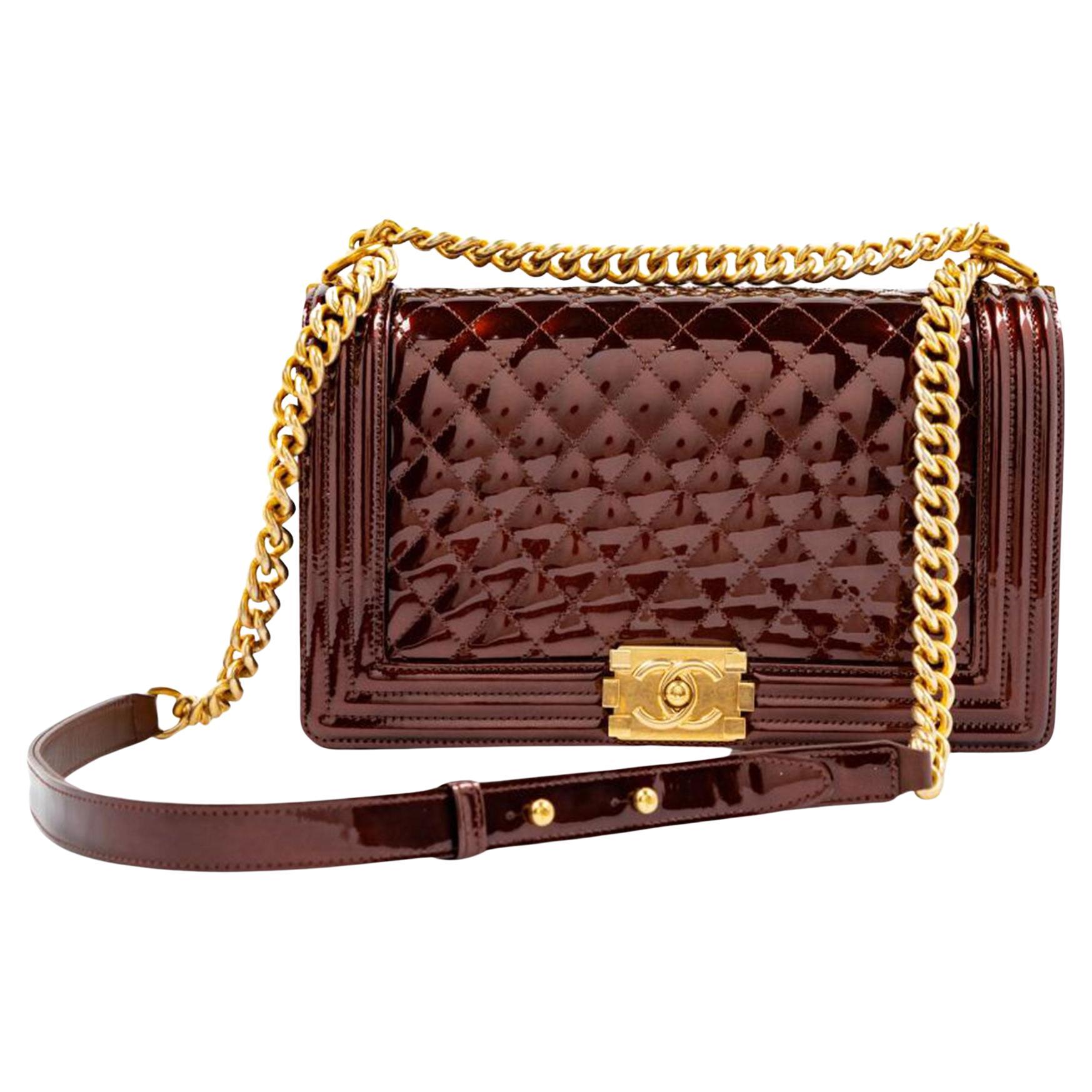 Limited Edition Chanel Old Medium Rare Metallic Bronze Gold Boy Bag

Year: 2017 
Chanel Dark Brown Bronze Quilted Patent Leather Large Boy Flap Bag
Patent Leather in gold
Gold Hardware
Interior lined gold lambskin
Boy bag clasp closure
Single Strap