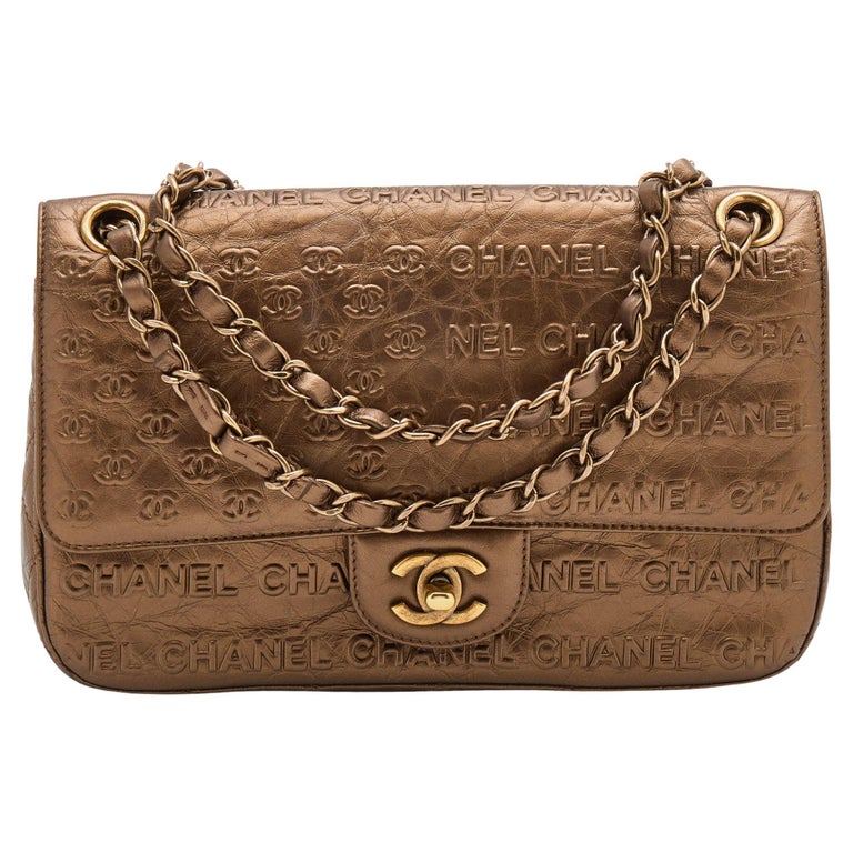 Chanel Metallic Bronze Leather Logo Embossed Flap Bag at 1stDibs