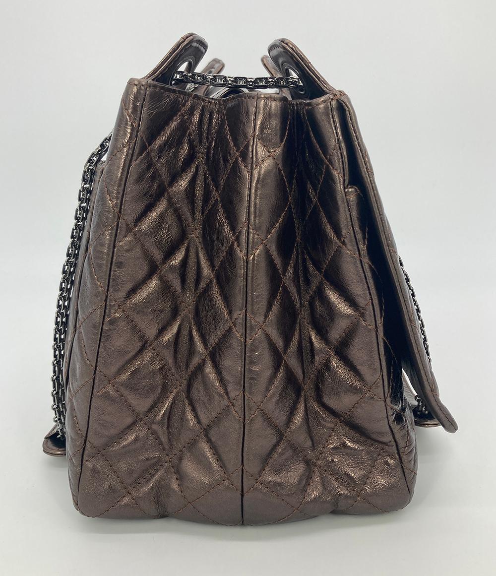 Chanel Metallic Bronze Quilted Leather Classic Flap Shopping Tote in excellent condition. Metallic bronze quilted glazed calfskin exterior trimmed with gunmetal hardware. Classic flap front pocket with mademoiselle twist closure. Back slit pocket.
