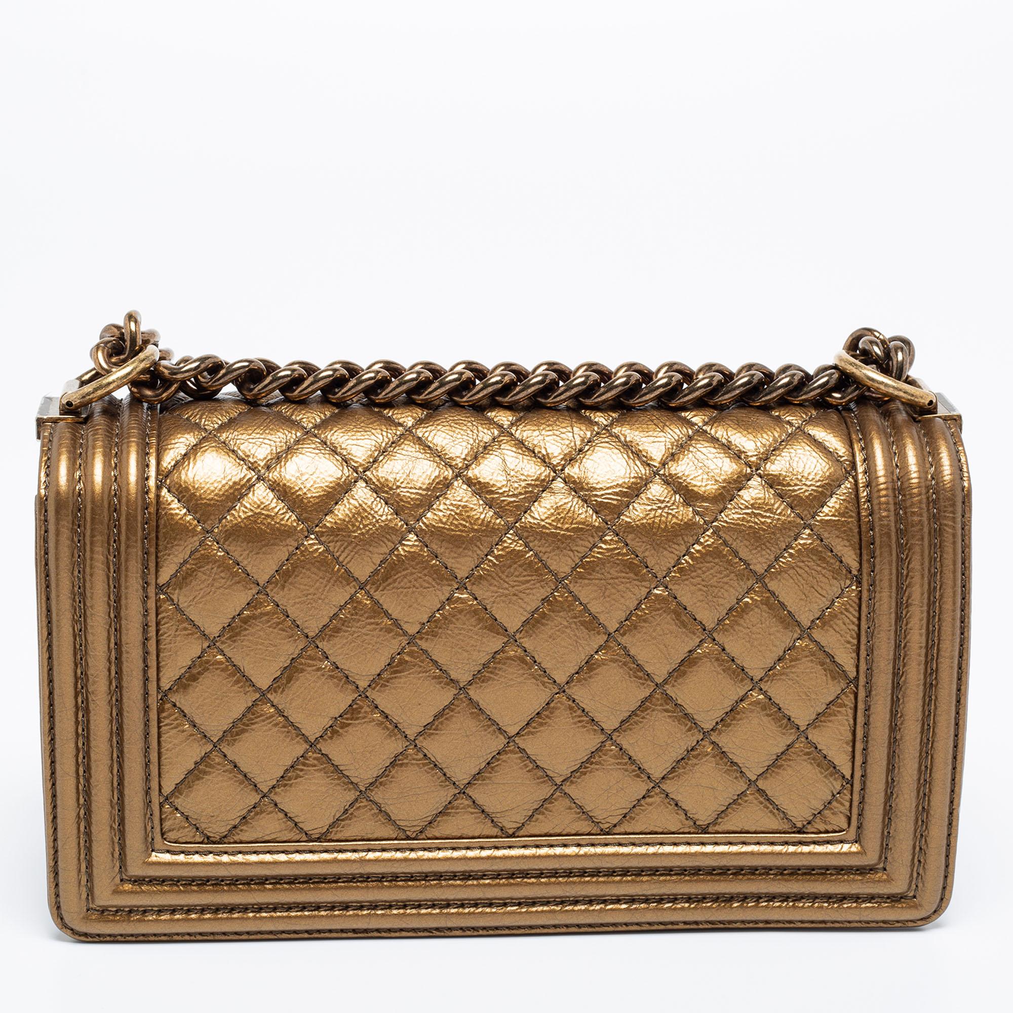 Eyed by women worldwide, Chanel's luxurious Boy bag is a must-have in your closet! The stunning Medium Boy bag is made from metallic bronze leather and has the timeless diamond quilt. It features bronze-tone hardware and the iconic CC logo on the