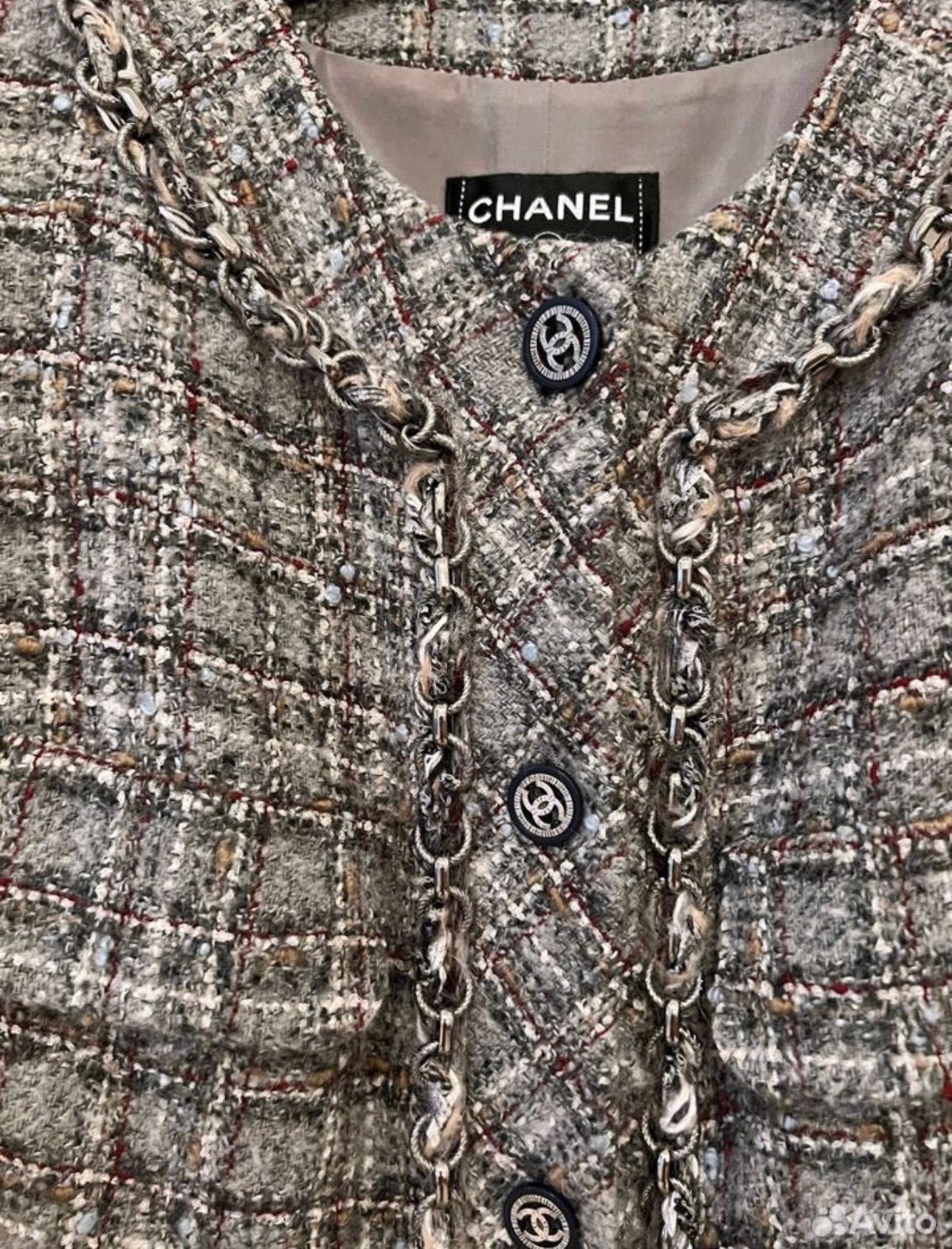 Rare Chanel blueish gray tweed jacket with signature metallic chain trim throughout.
- boutique price over 11,000$
- CC logo buttons
- iconic 4-pockets silhouette
- tonal silk lining
Size mark 38 FR. Pristine condition.