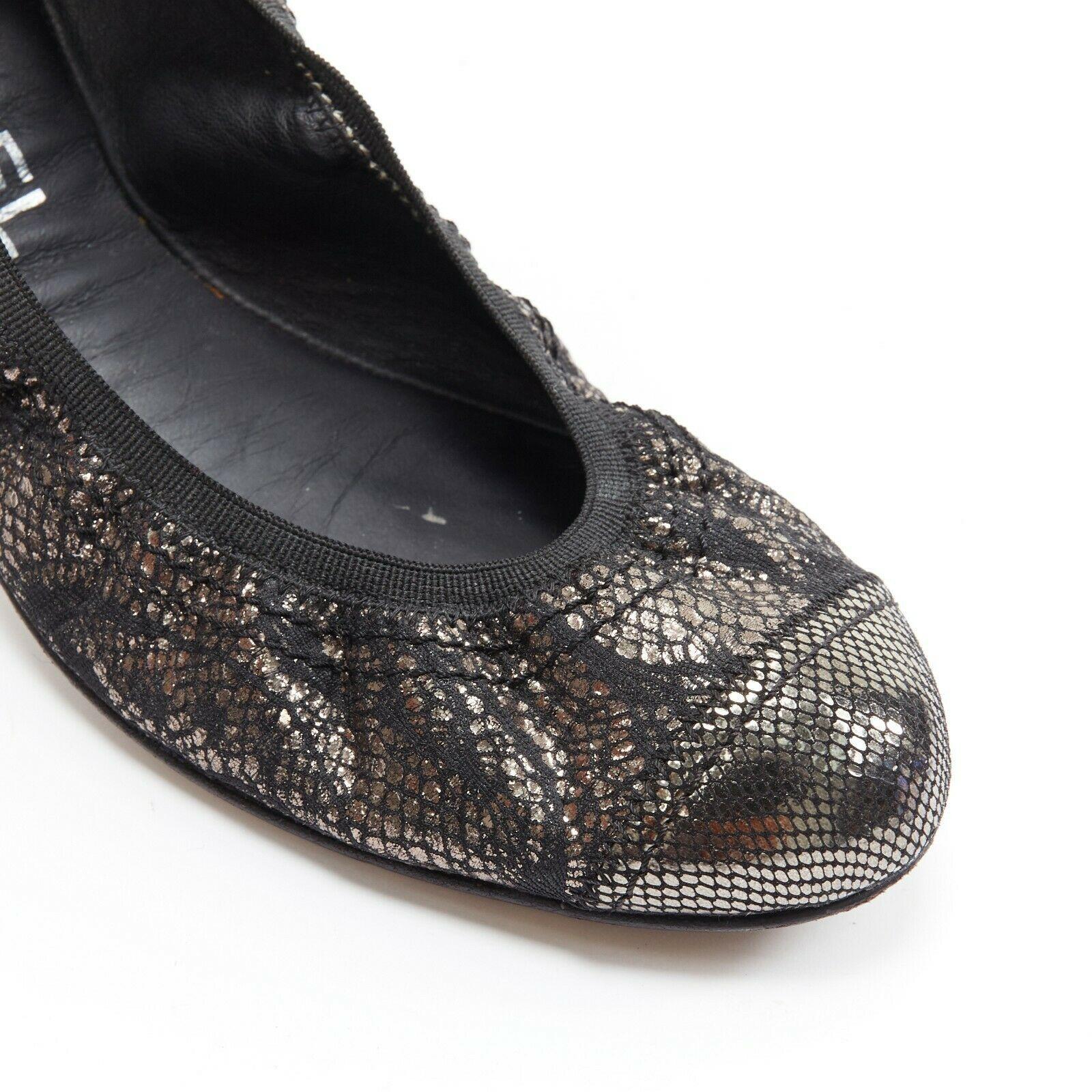 CHANEL metallic copper black print stretch fit flat ballerina flats EU36.5C
Designer: Chanel
Material: Copper, fabric
Extra Details: Metallic copper printed fabric upper. Rounded toe. Stretch fit ballerina. Quilted rubber sole. 
Made in