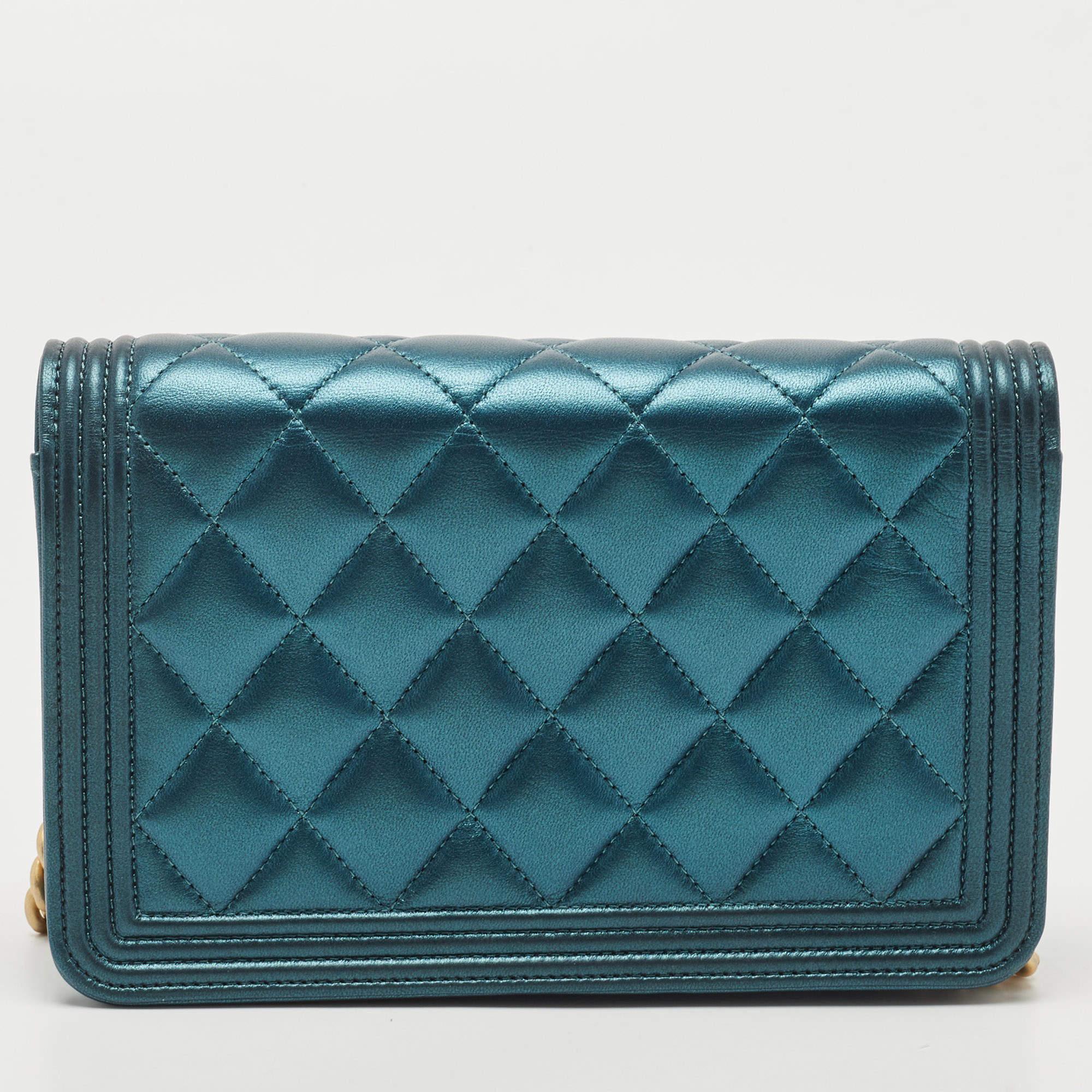 The Chanel WOC is a captivating blend of luxury and edginess. Crafted from supple dark green leather, it features the iconic diamond quilted pattern, enhanced by a metallic finish for a glamorous touch. The Boy WOC design offers versatility with its