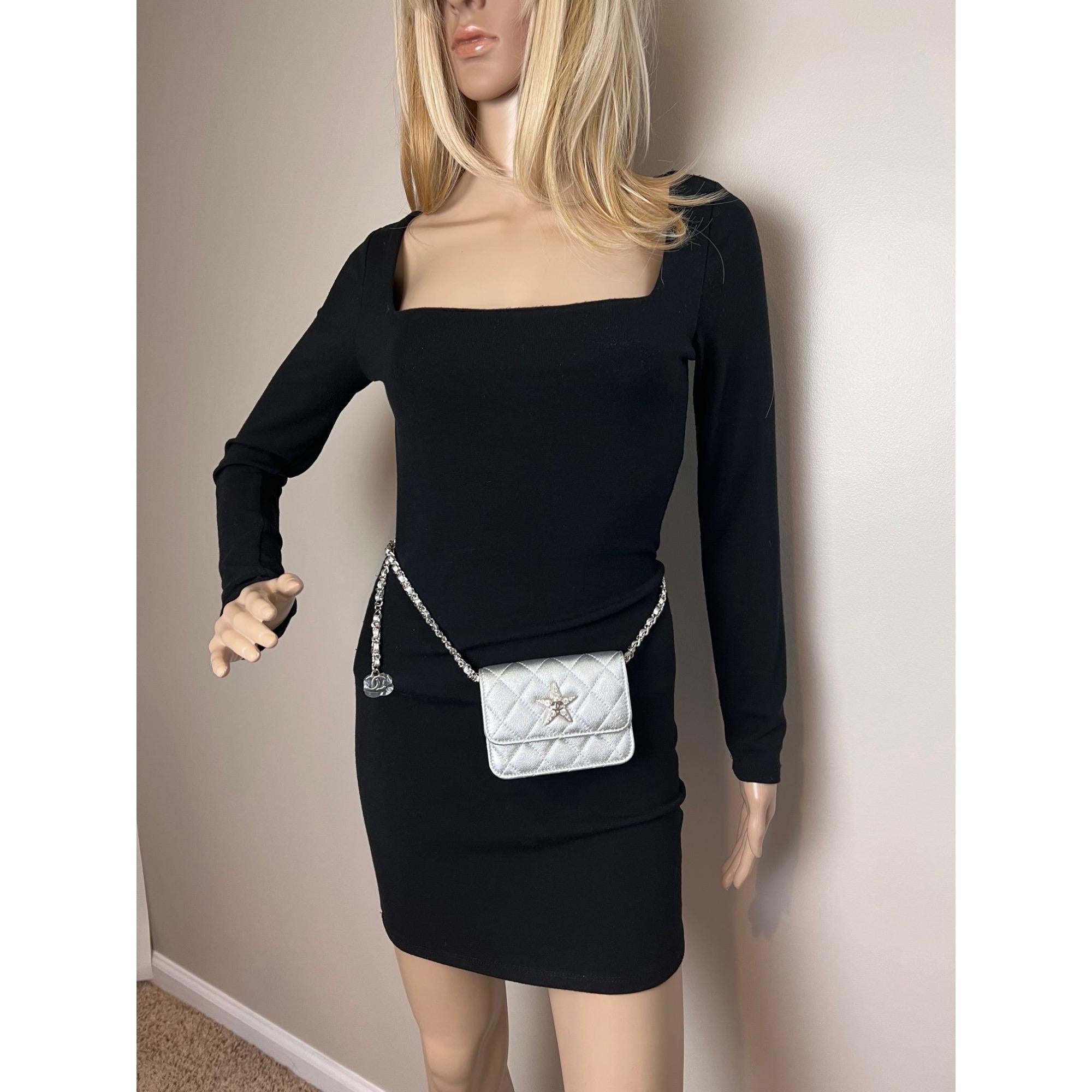 Pre-Owned  100% Authentic
Chanel Metallic Goatskin Quilted Star Flap Waist Belt Shoulder Bag 
Wear this stuning piece as a waist or shoulder bag 
RATING: A...excellent, near mint, has little to no signs of wear
MATERIAL: goatskin 
STRAP: silver with